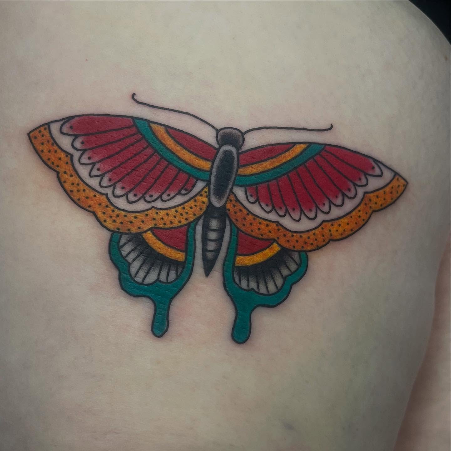 Butterfly American traditional tattoo on the shoulder by Mariah Nguyen