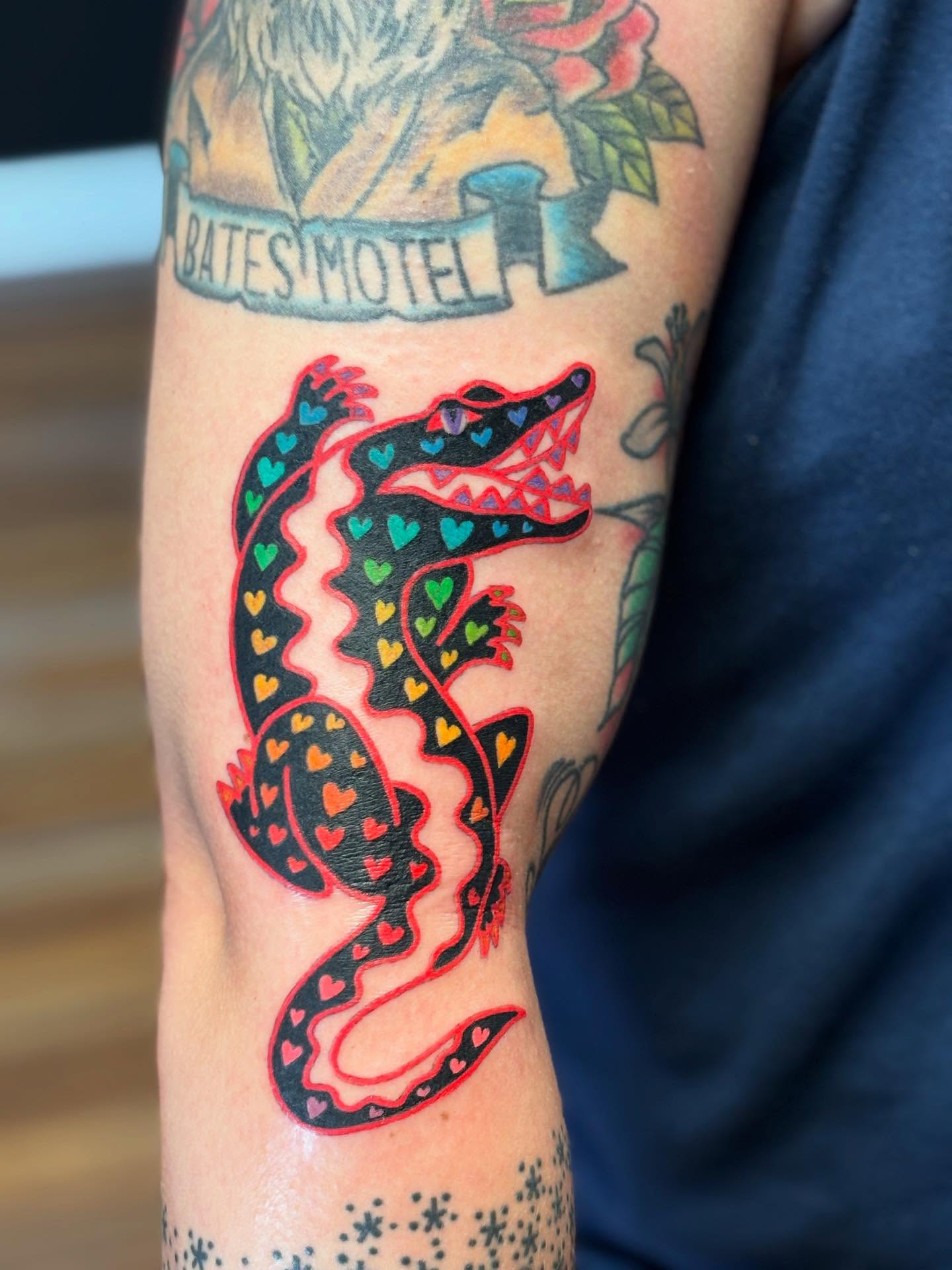 Alligator trash polka tattoo on the forearm by MJ Saunders