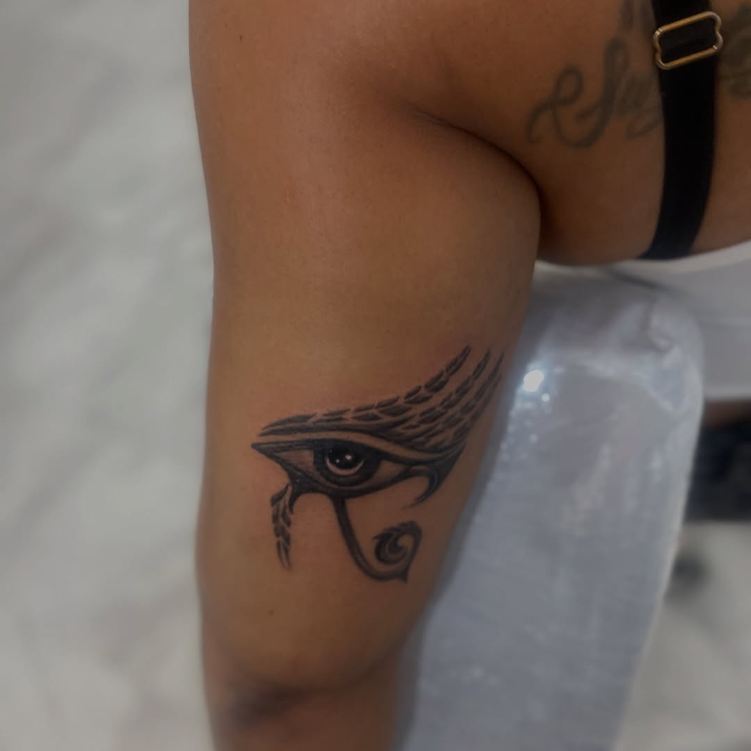 Eye of Horus tribal tattoo on the thigh by Jayme