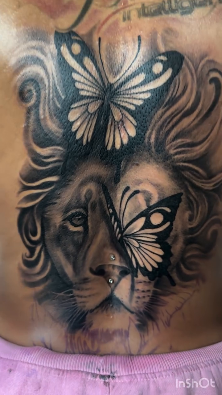 Lion and butterfly realism tattoo by Juan c munoz jr, Chicago, Illinois