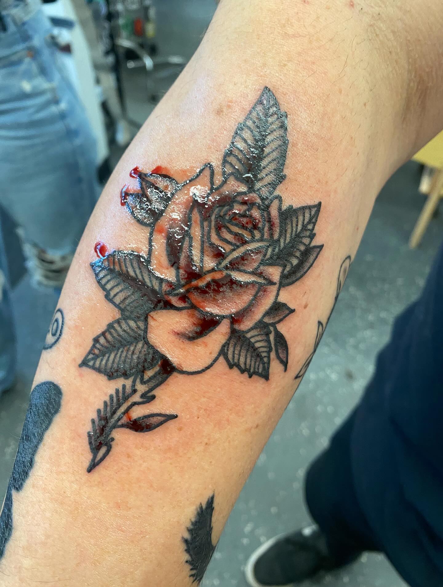 Rose black and grey tattoo on the forearm by Payton Prentice