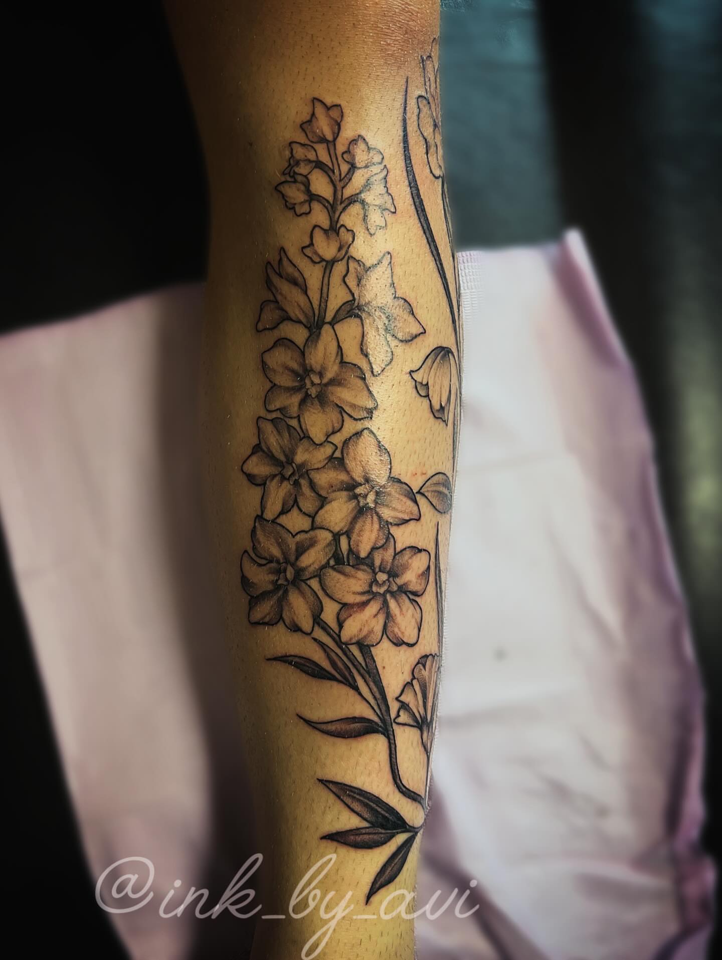 Floral arrangement black and grey tattoo on the forearm by Avi, Cleveland, Ohio