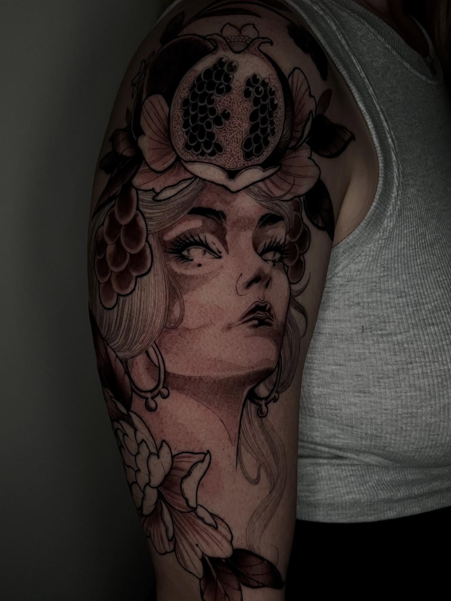 Woman's face realism tattoo on the upper arm by Angelo Buonanno, Las Vegas, Nevada