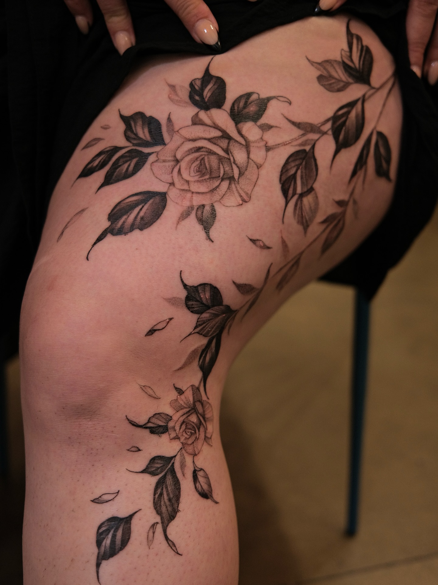 Rose black and grey tattoo on the thigh by Morrison Vo