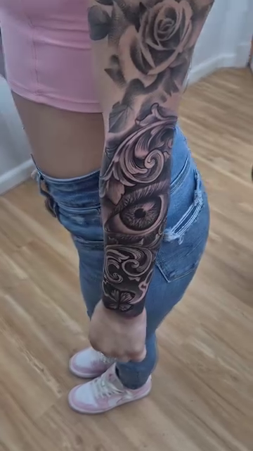 Full sleeve with eye and rose realism tattoo by Chris TL Jones