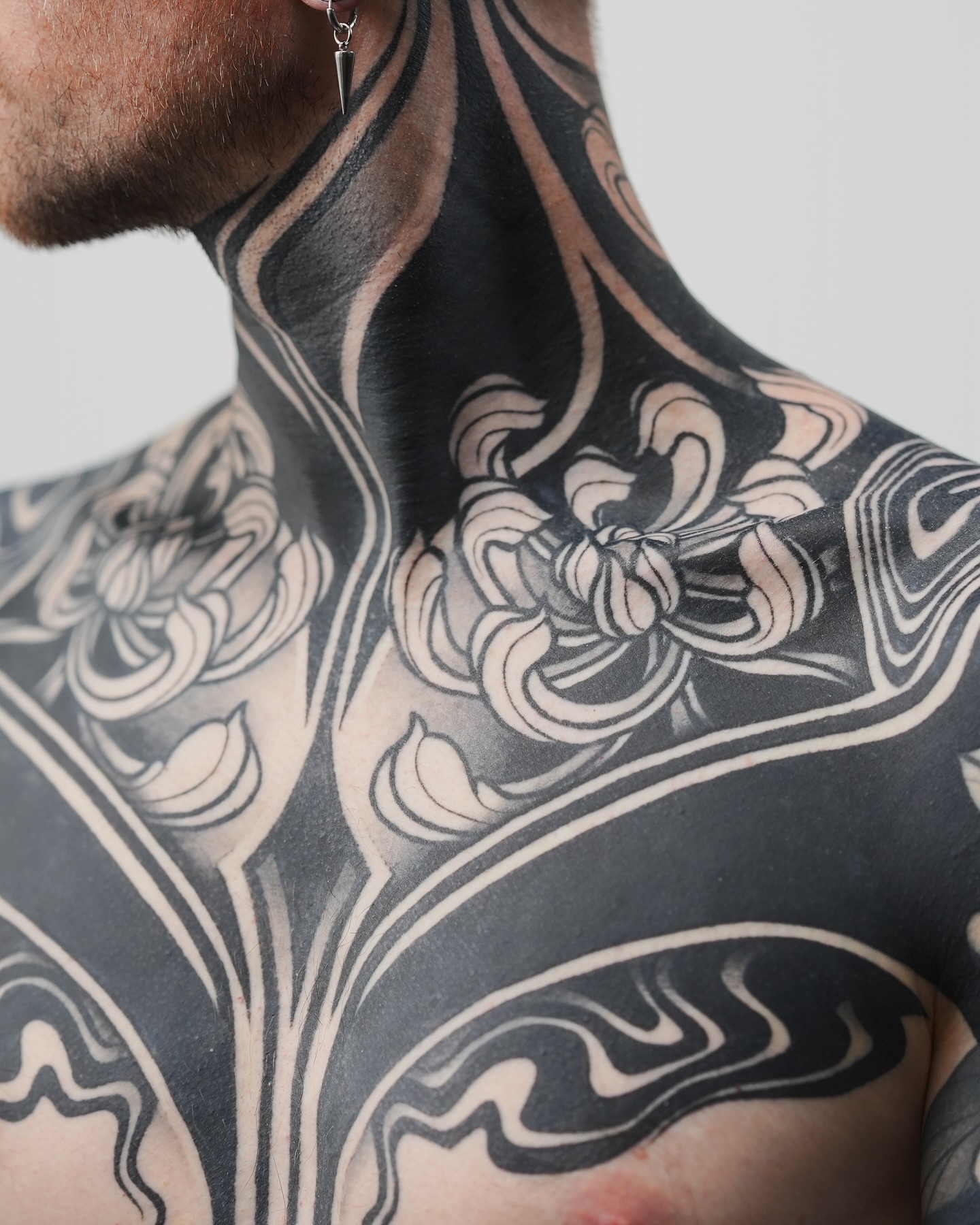 Floral black and grey tattoo on the neck by Katie Mizuno, Berkeley, California