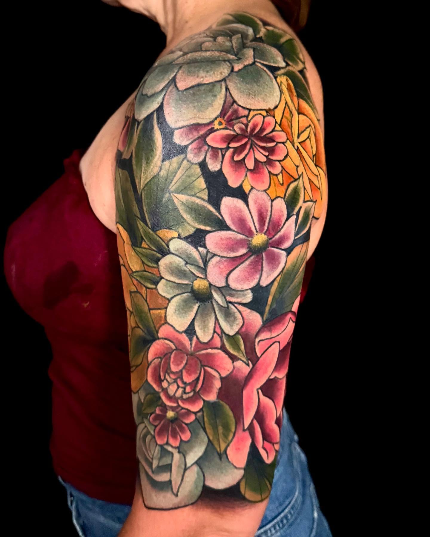 Floral bouquet realism tattoo on the upper arm by Sweets, Nashville, Tennessee