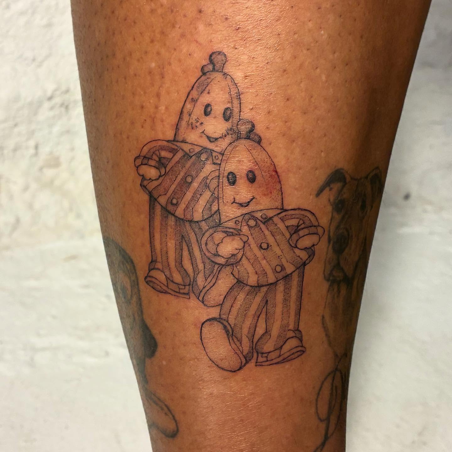 Caillou and Gnocchi black and grey tattoo on the leg by Shamalee Delacruz✨