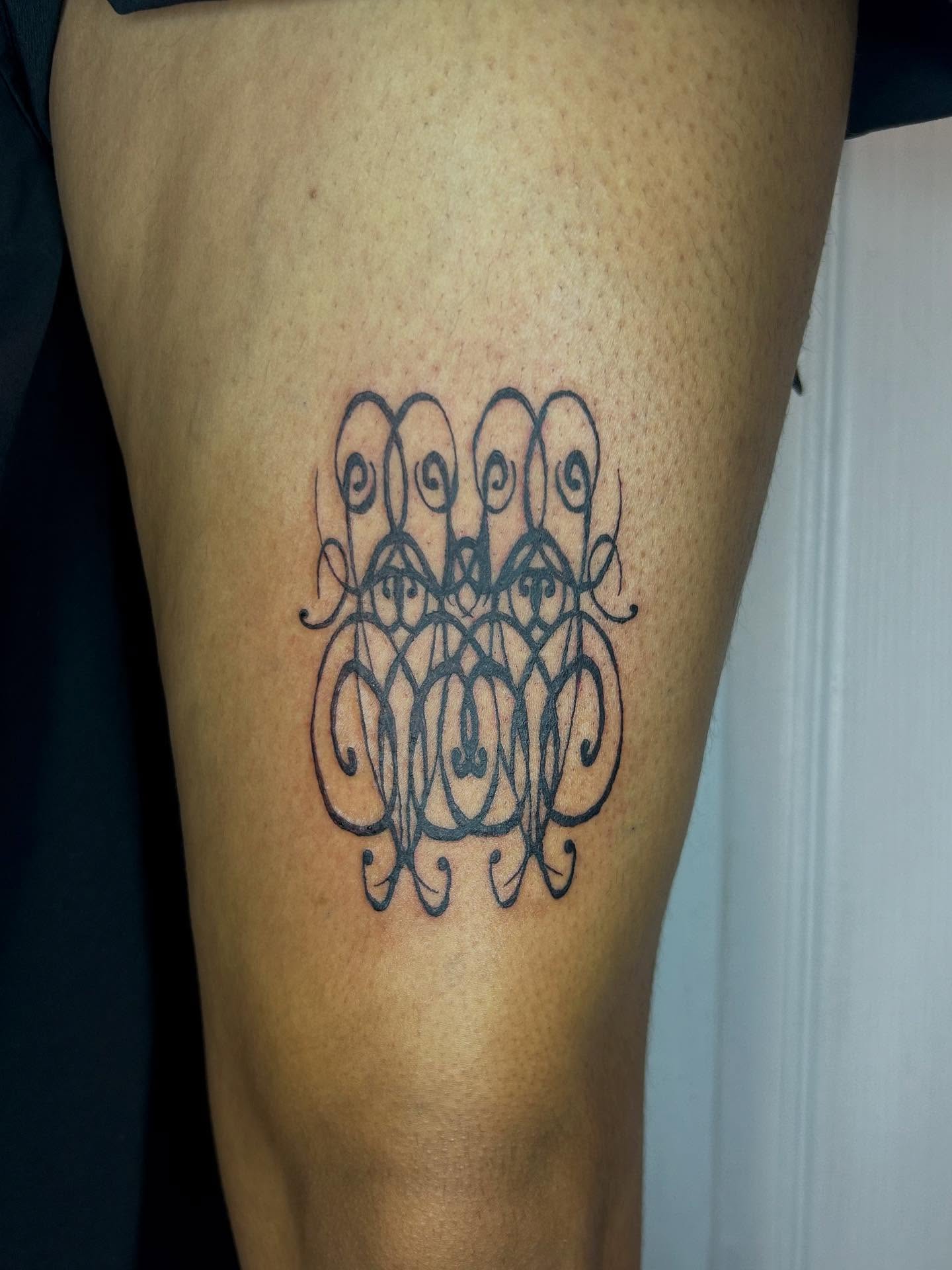 Swirled monogram lettering script tattoo on the thigh by (isa)ac ૮₍ ˃̵ࡇ˂̵ ₎ა