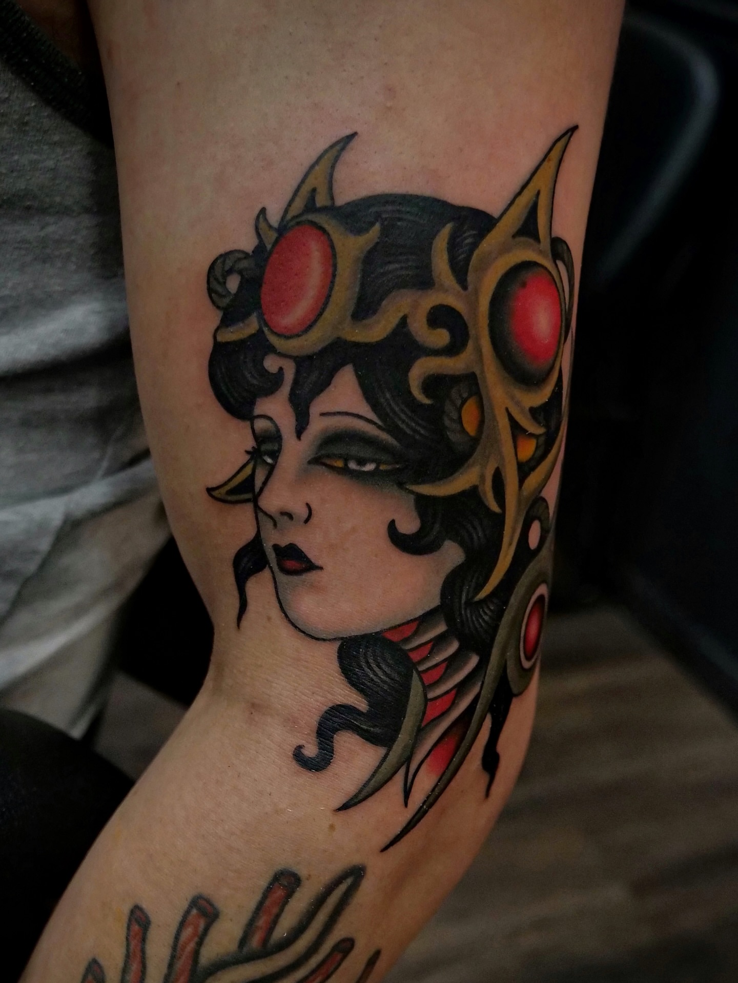 Woman with cat ears American traditional tattoo on the forearm by Brandon Murphy
