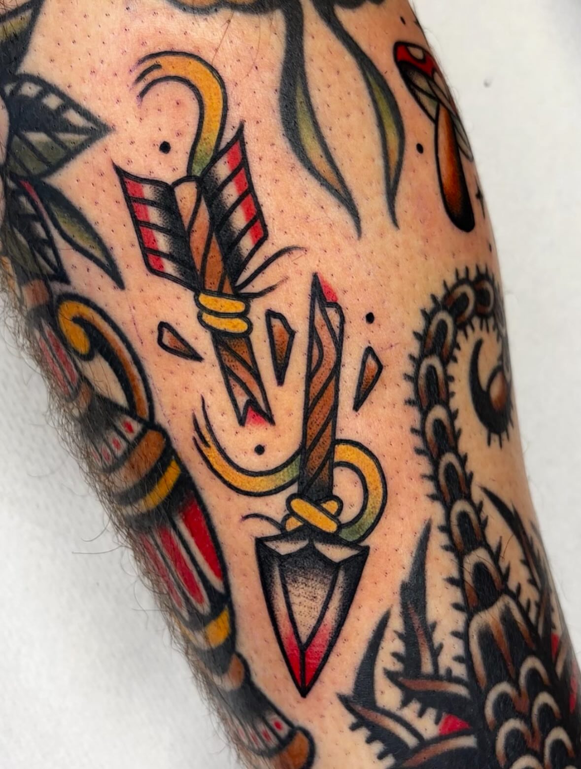 Sword and flame American traditional tattoo on the forearm by Arturo Ledesma