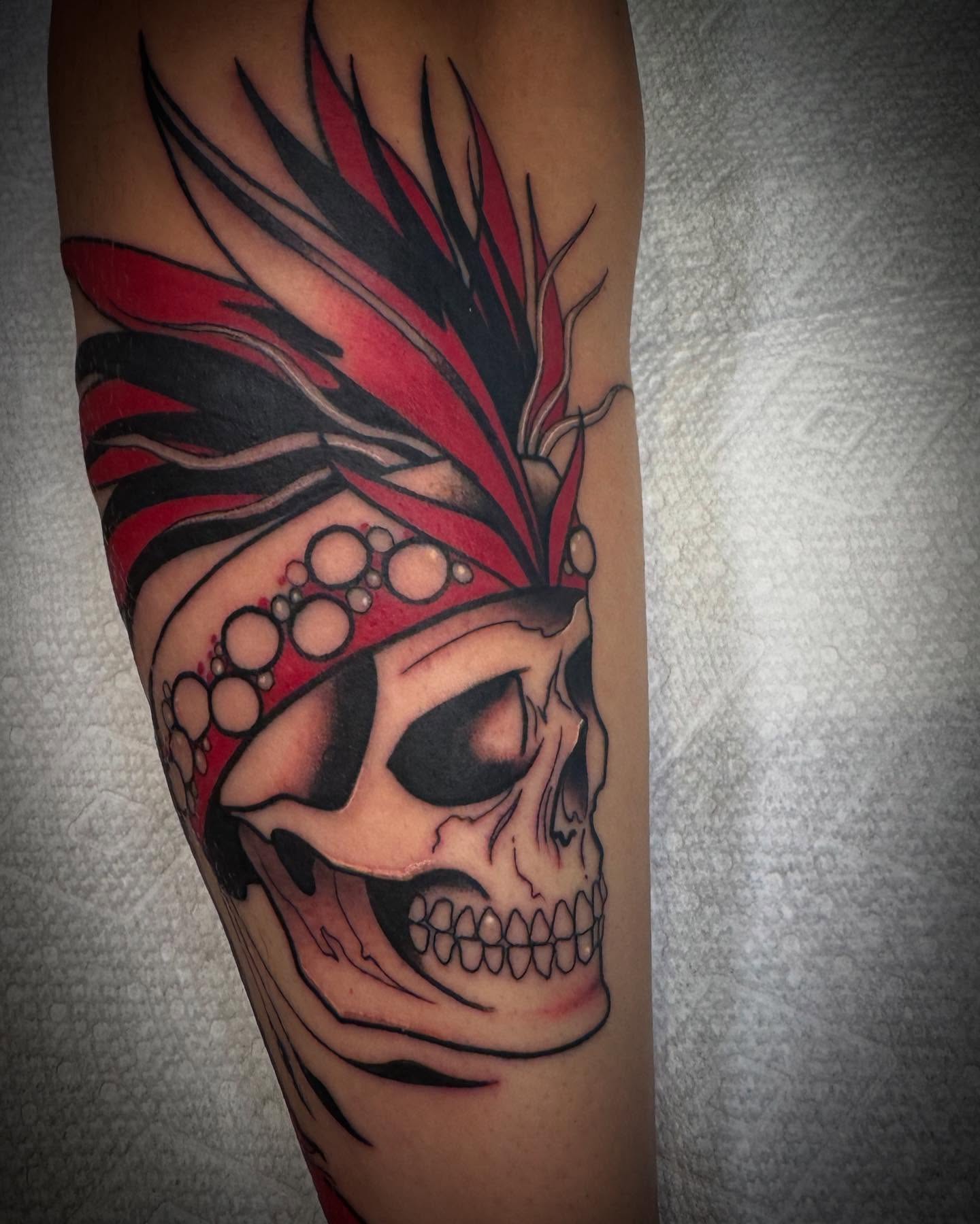 Skull with headdress realism tattoo on the forearm by Paul Giovis