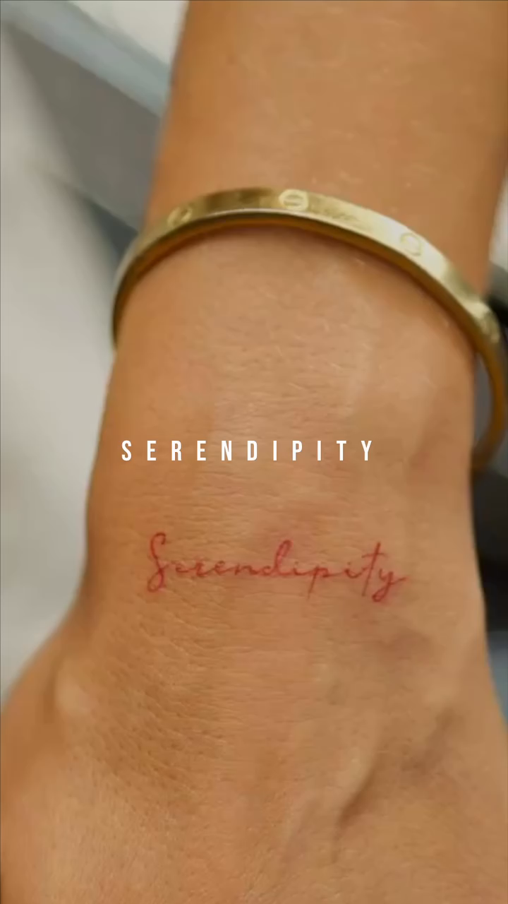 Serendipity script lettering script tattoo by @blackastaratattoo