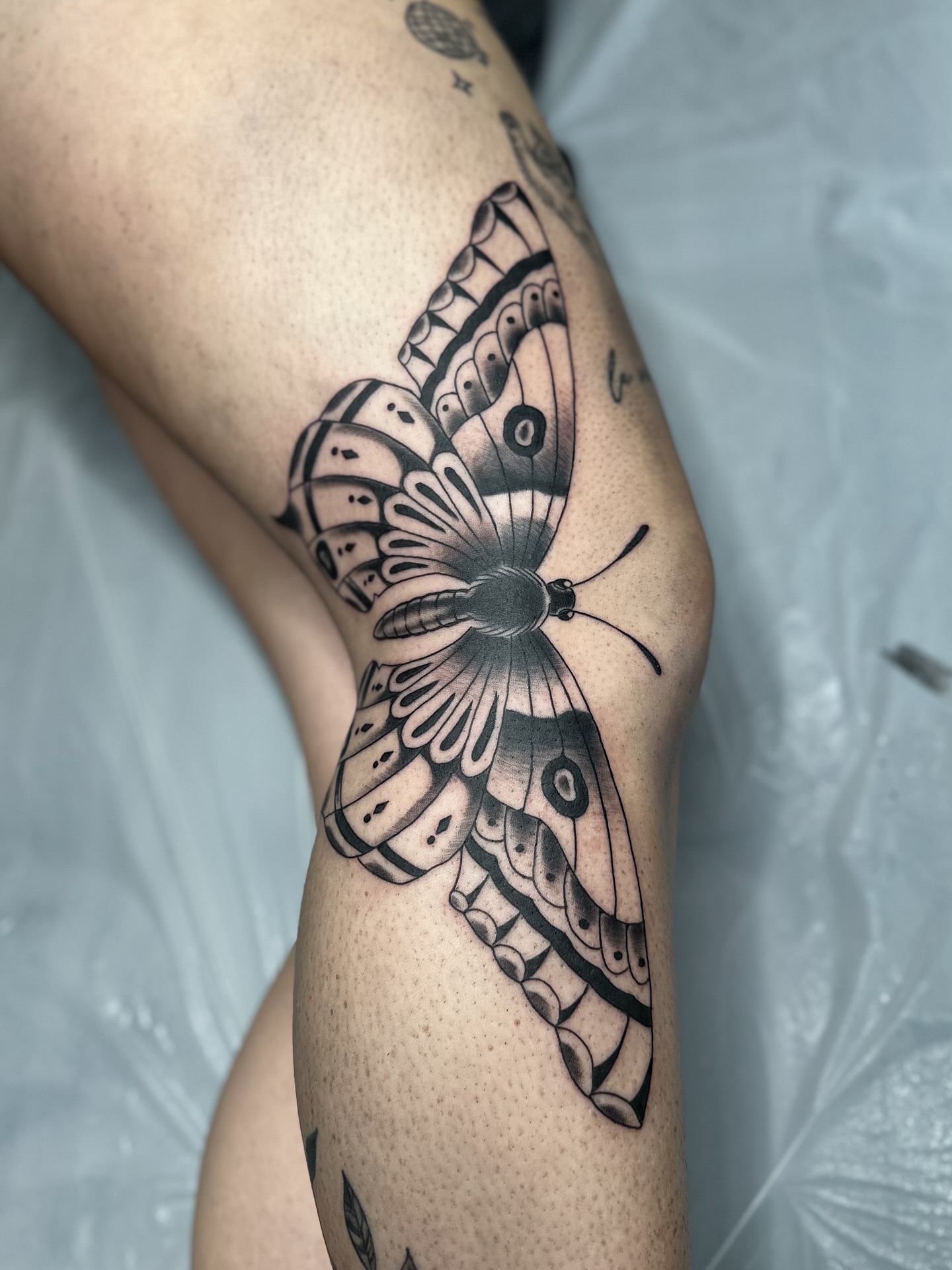 Butterfly black and grey tattoo on the thigh by แดแด ๐ฎ๐ท ๐ฆ๐ซ