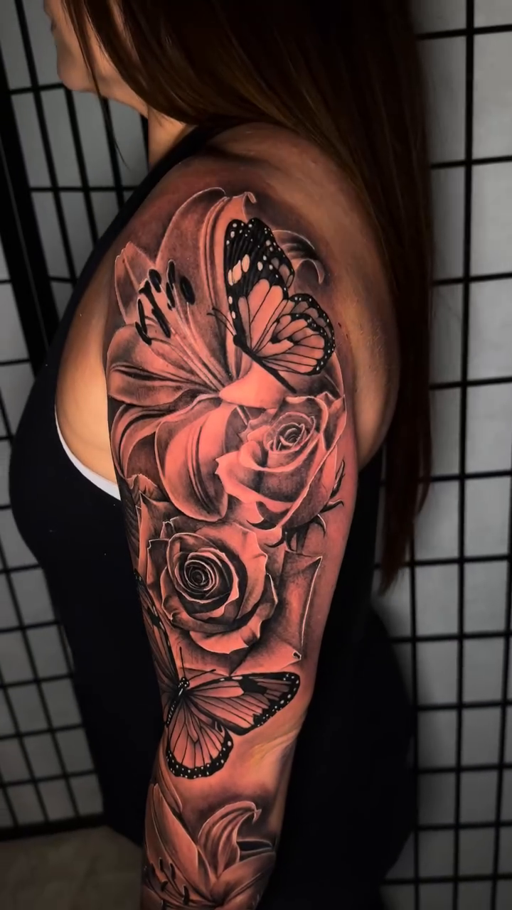 Full sleeve floral and butterfly tattoo realism tattoo by Anthony Ramirez