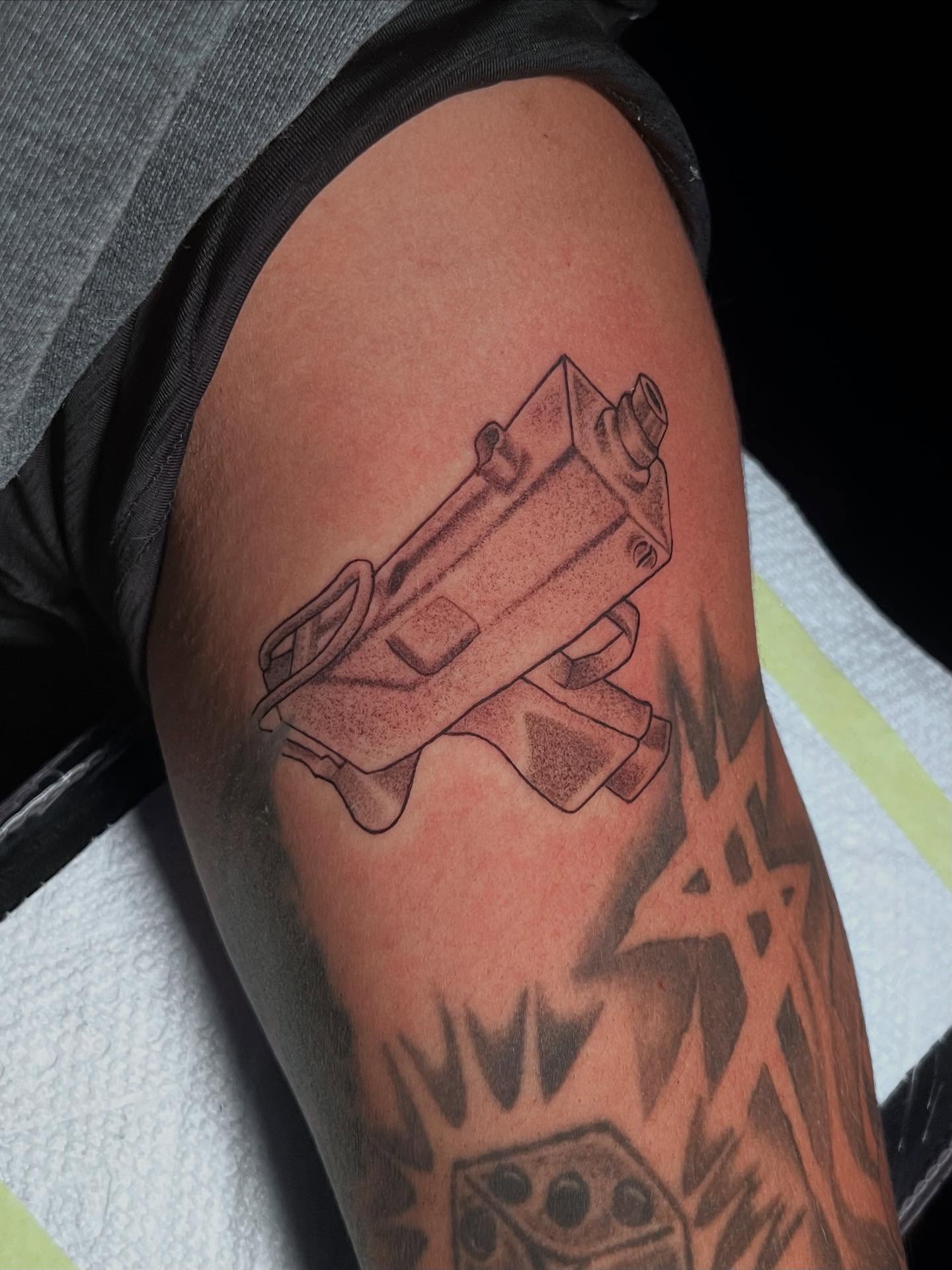 Gun dotwork tattoo on the forearm by Gerardo Galicia, New York, New York
