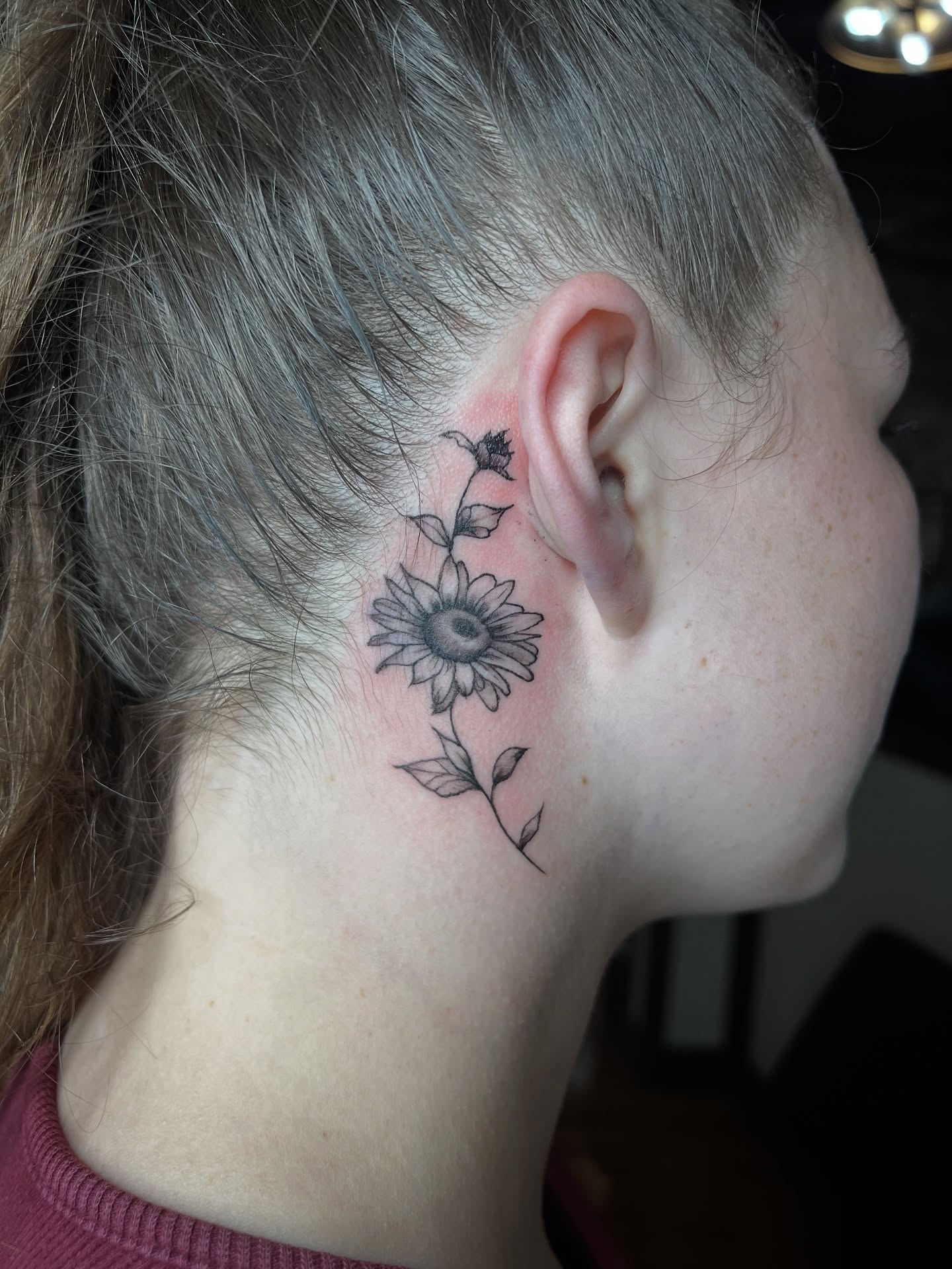 Sunflower black and grey tattoo on the neck by Meghan B