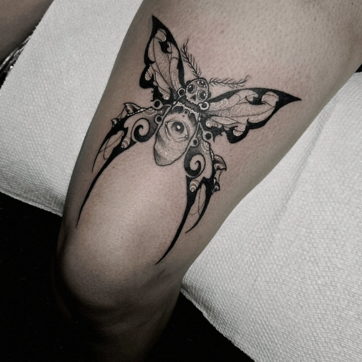 Butterfly ornamental tattoo on the forearm by Ema Fish