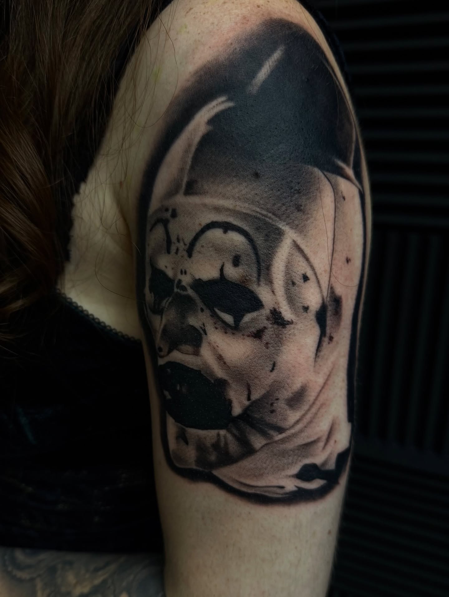 Abstract dark realism tattoo on the shoulder by Nick Campbell