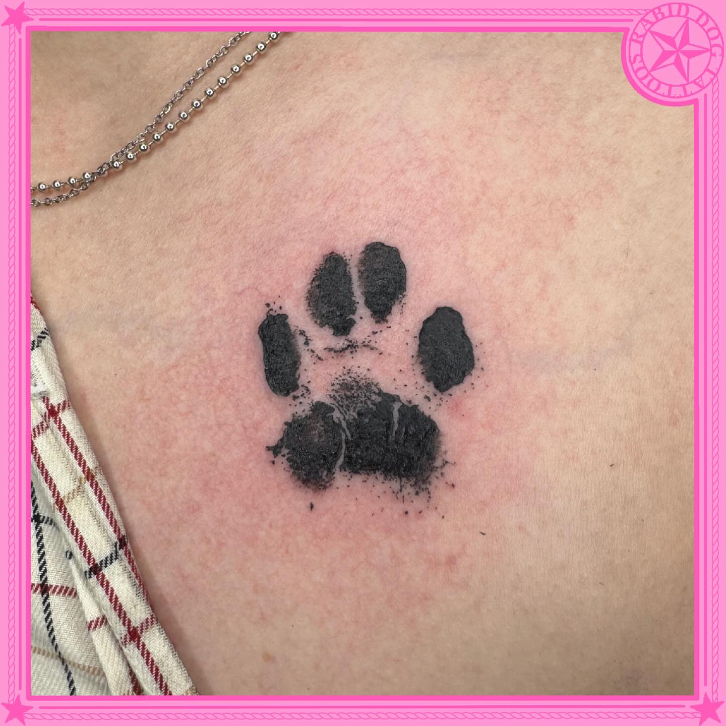 Paw print dotwork tattoo on the chest by 𝕷𝖊𝖝𝖎 𝕽𝖚𝖓𝖞𝖔𝖓