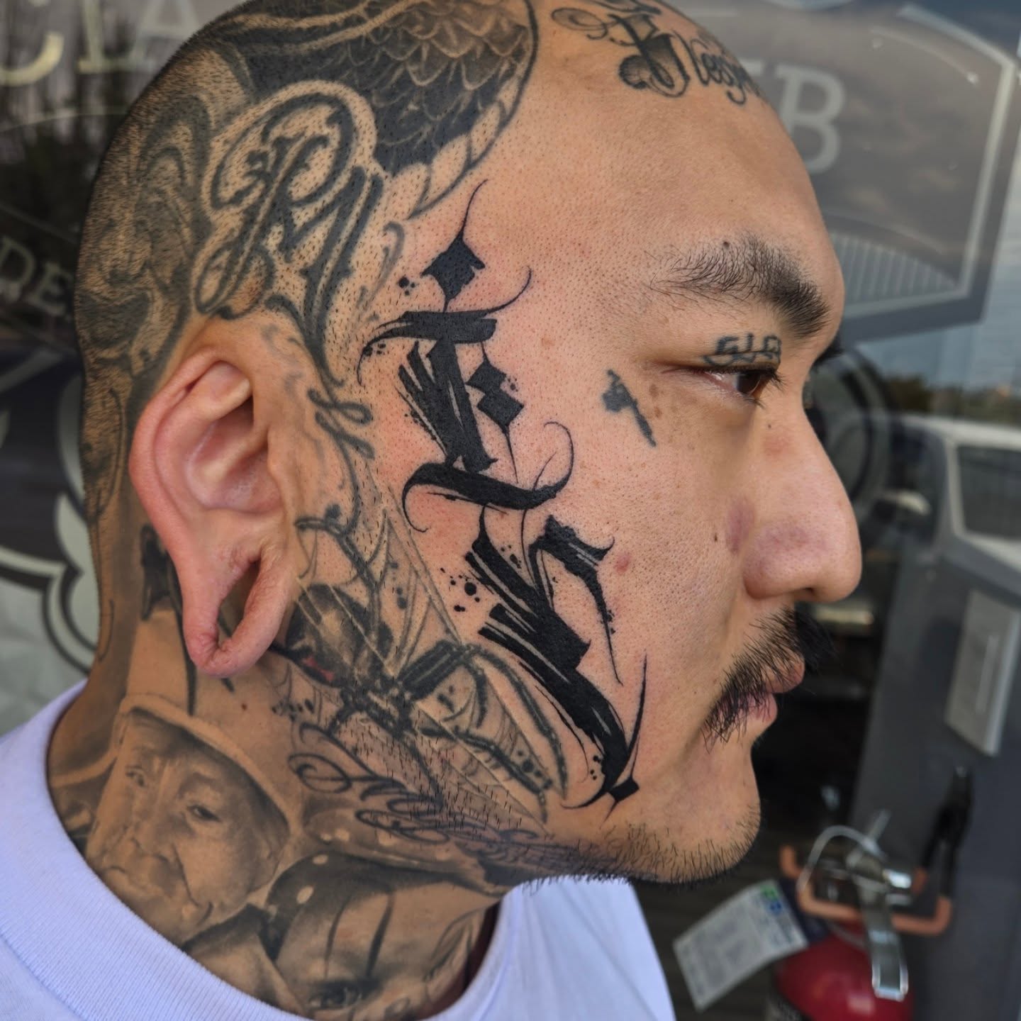 Face tattoo black and grey tattoo on the head by DiazTattoos, Denver, Colorado