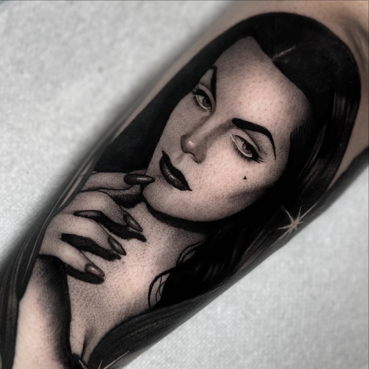 Woman with long nails realism tattoo on the forearm by Luna Lucero