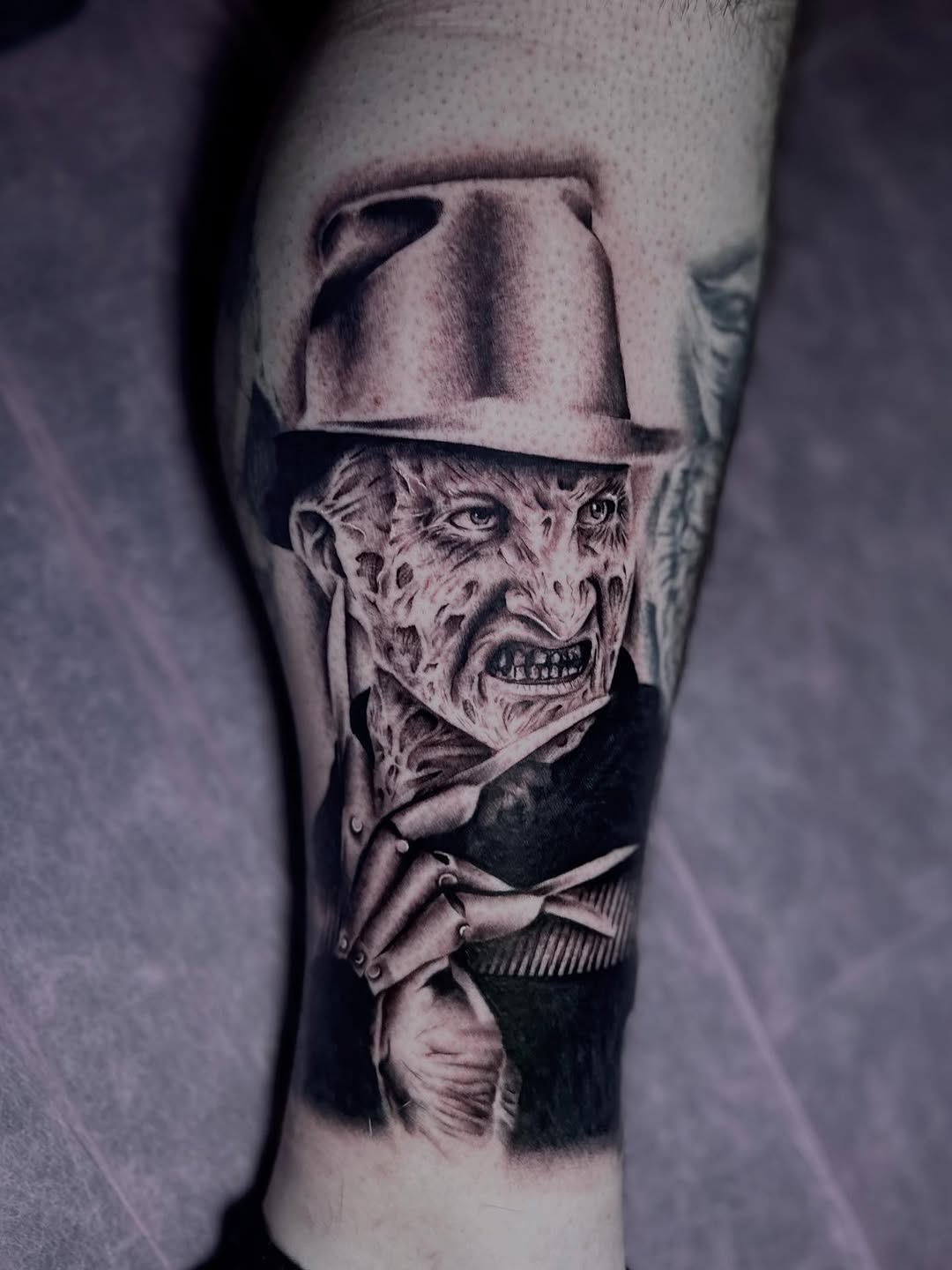 Freddy Krueger portrait realism tattoo on the forearm by Erika Nambo