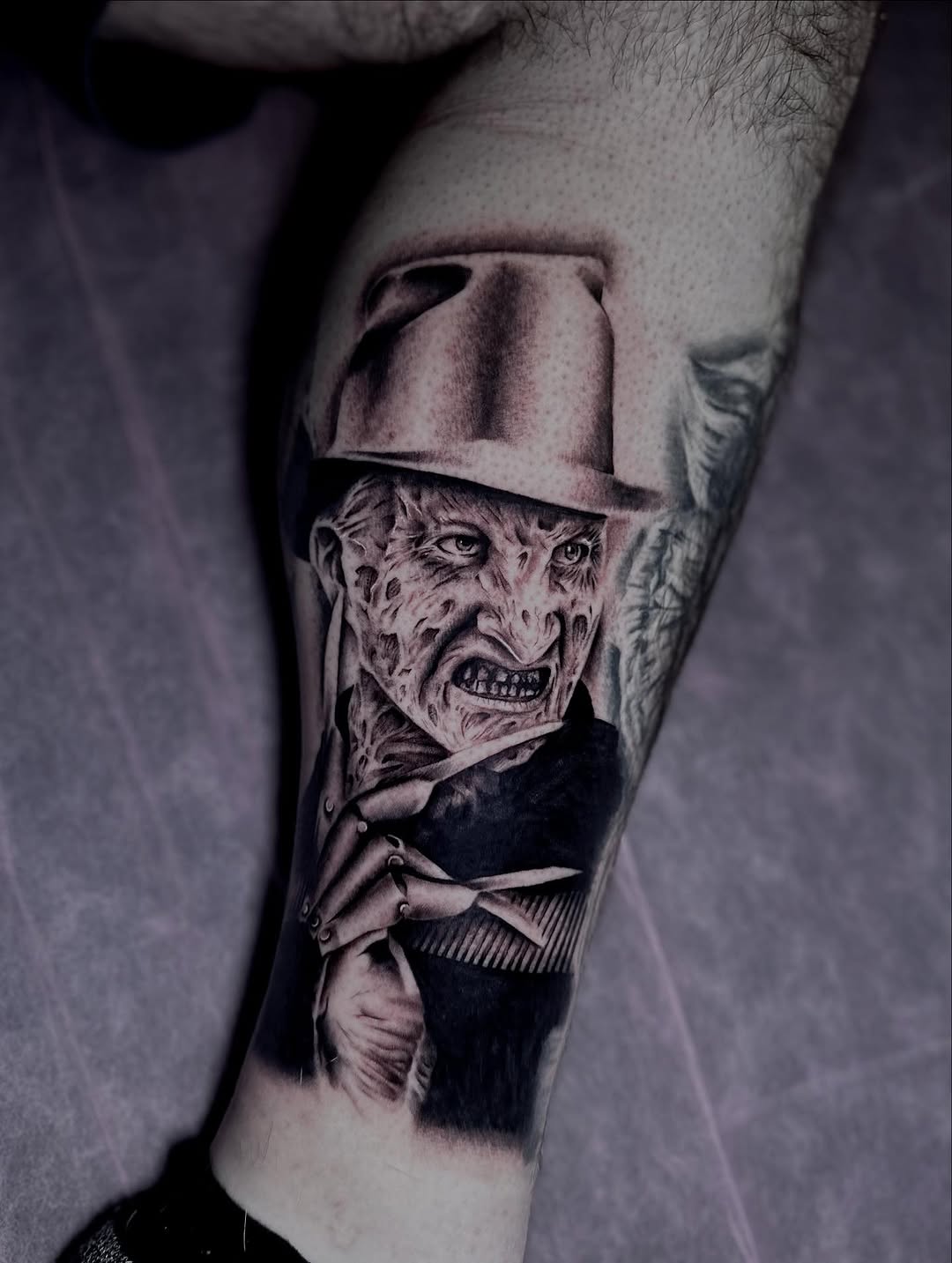 Freddy Krueger realism tattoo on the forearm by Erika Nambo