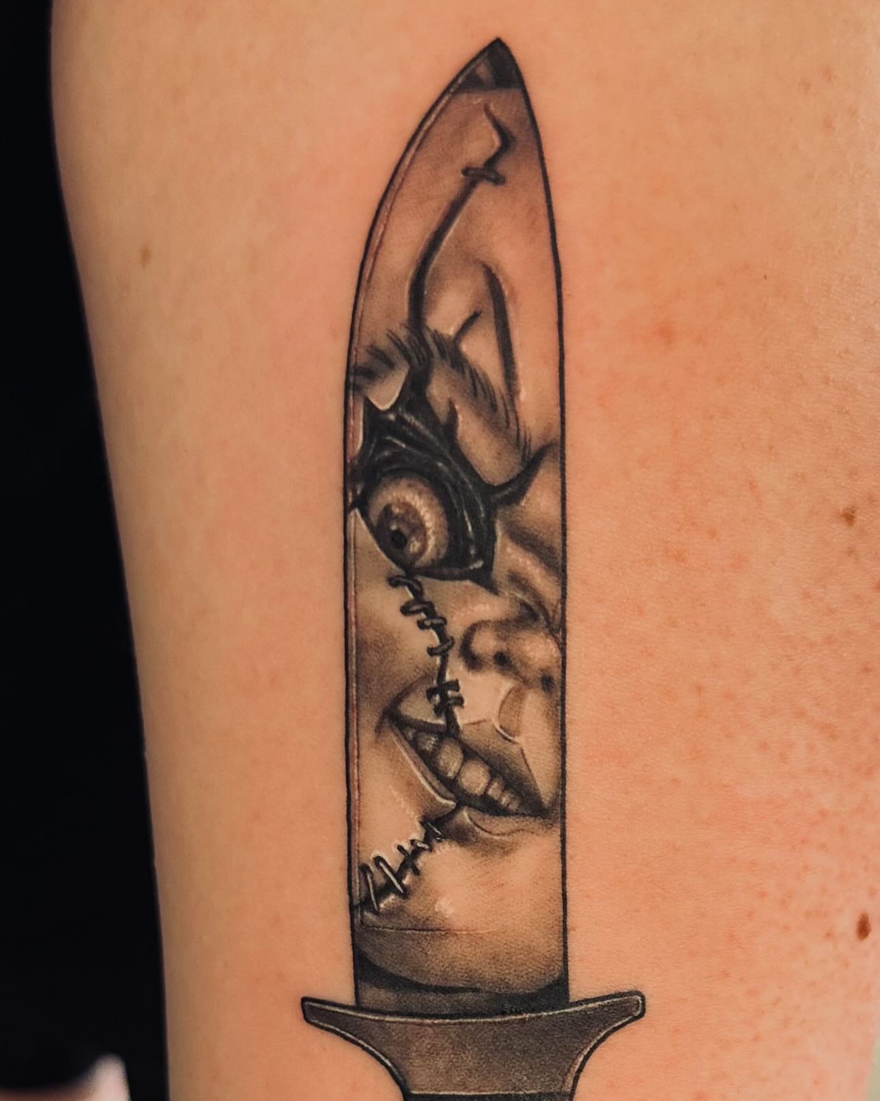 Knife with face realism tattoo on the forearm by Cuzmatt