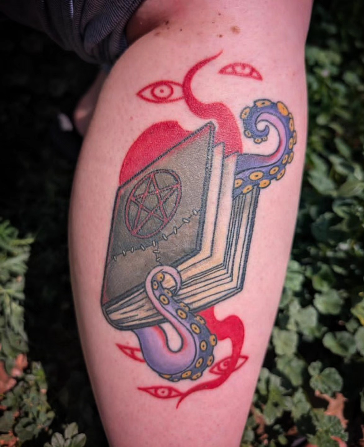 Book with octopus new school tattoo on the thigh by ✶ 𝓑𝓲𝓽𝓮𝓼𝓲𝔃𝓮𝓭 𝓘𝓷𝓴 ✶, Buford, Georgia