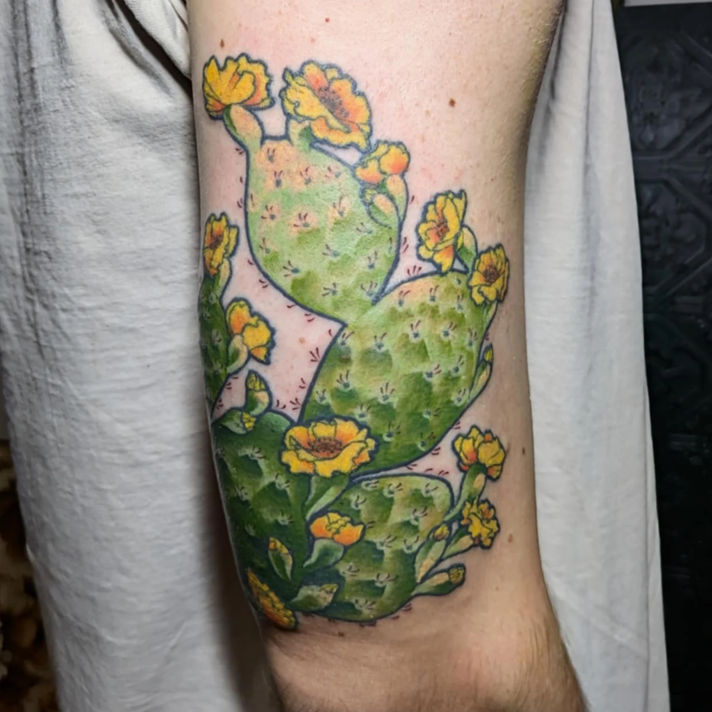 Prickly pear cactus watercolor tattoo on the forearm by Ayla Stone, Salt Lake City, Utah