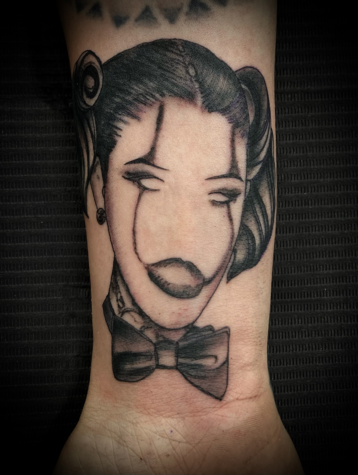 Monkey head black and grey tattoo on the forearm by Bobby Trefz