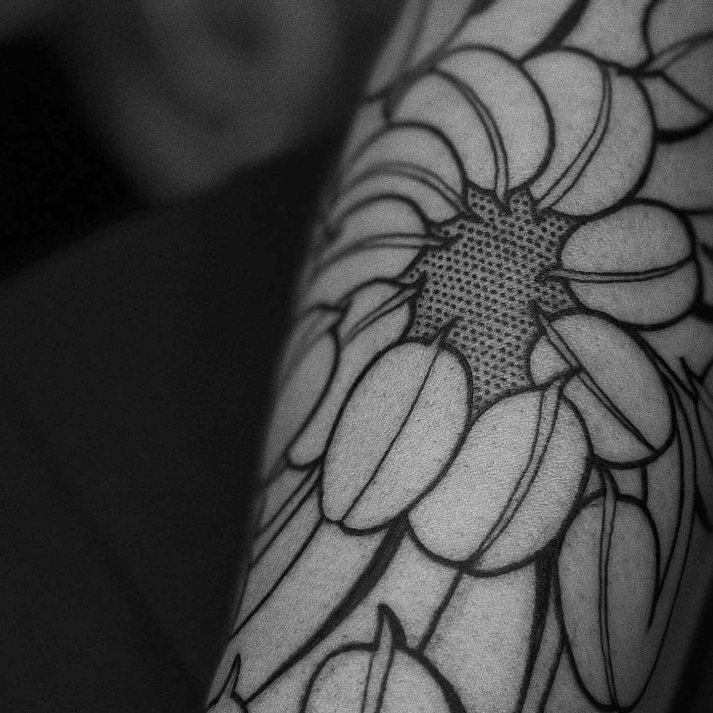 Sunflower dotwork tattoo on the shoulder by t a y l o r