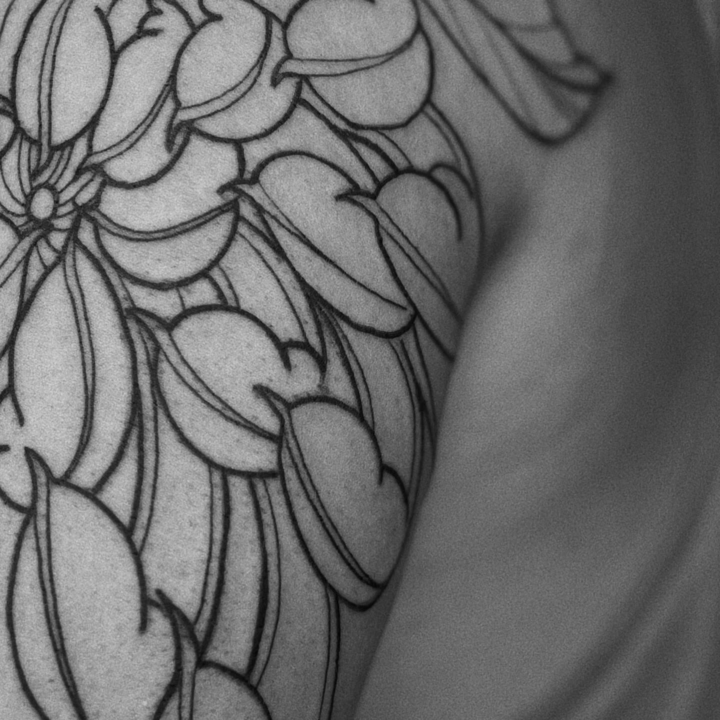 Floral pattern black and grey tattoo on the shoulder by t a y l o r