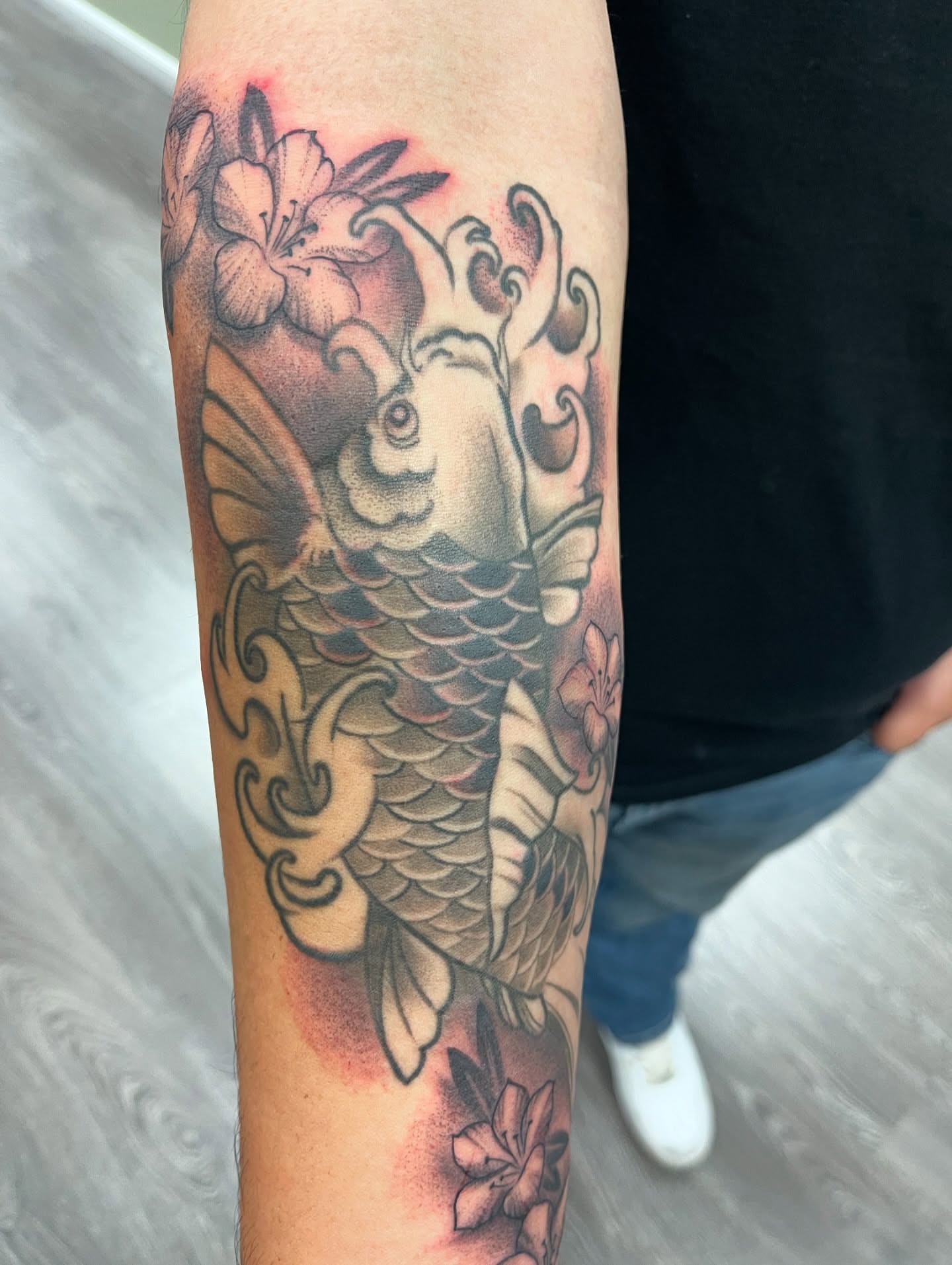 Koi fish and flowers japanese irezumi tattoo on the forearm by Alex