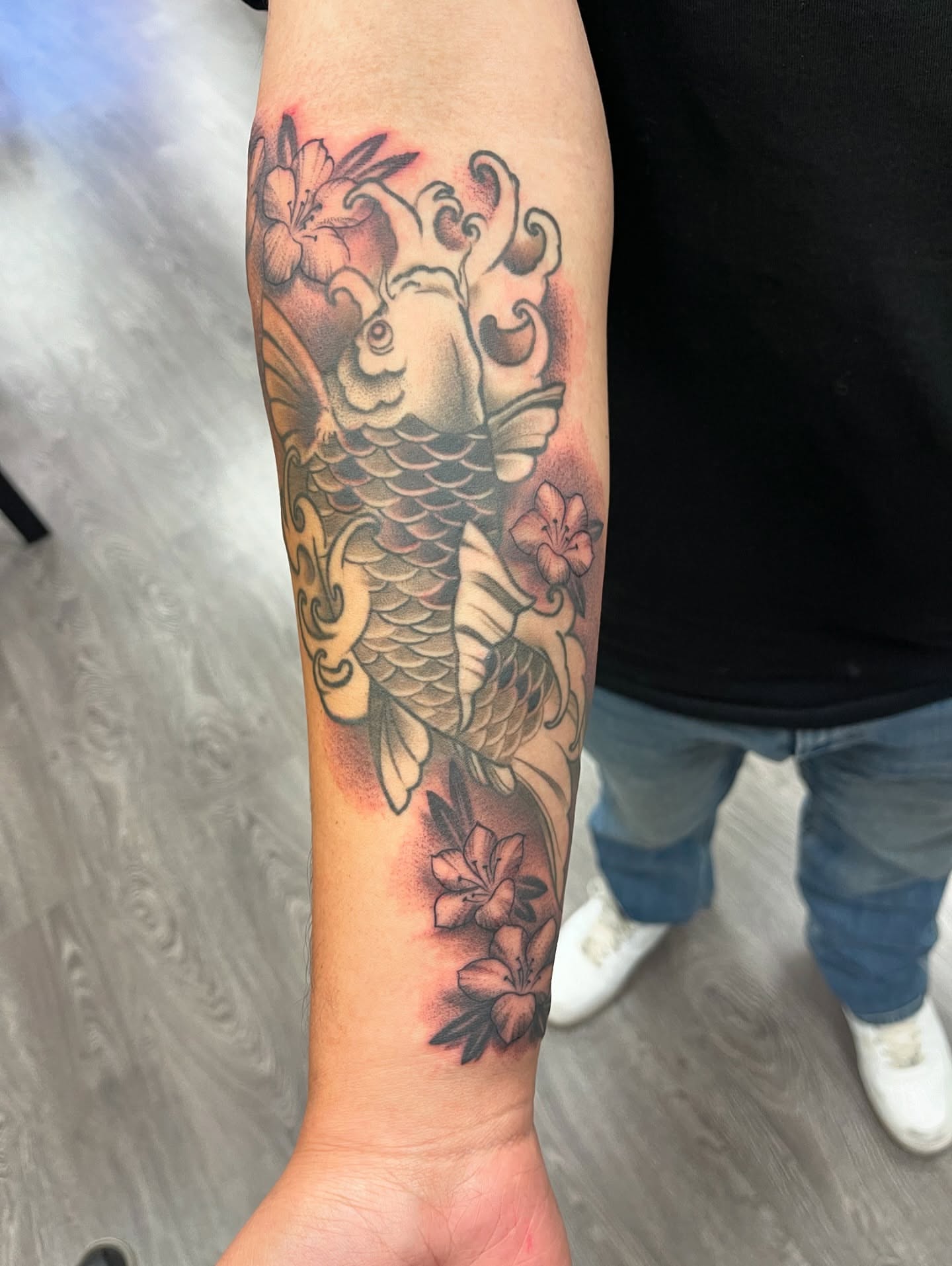 Koi fish and flowers japanese irezumi tattoo on the forearm by Alex