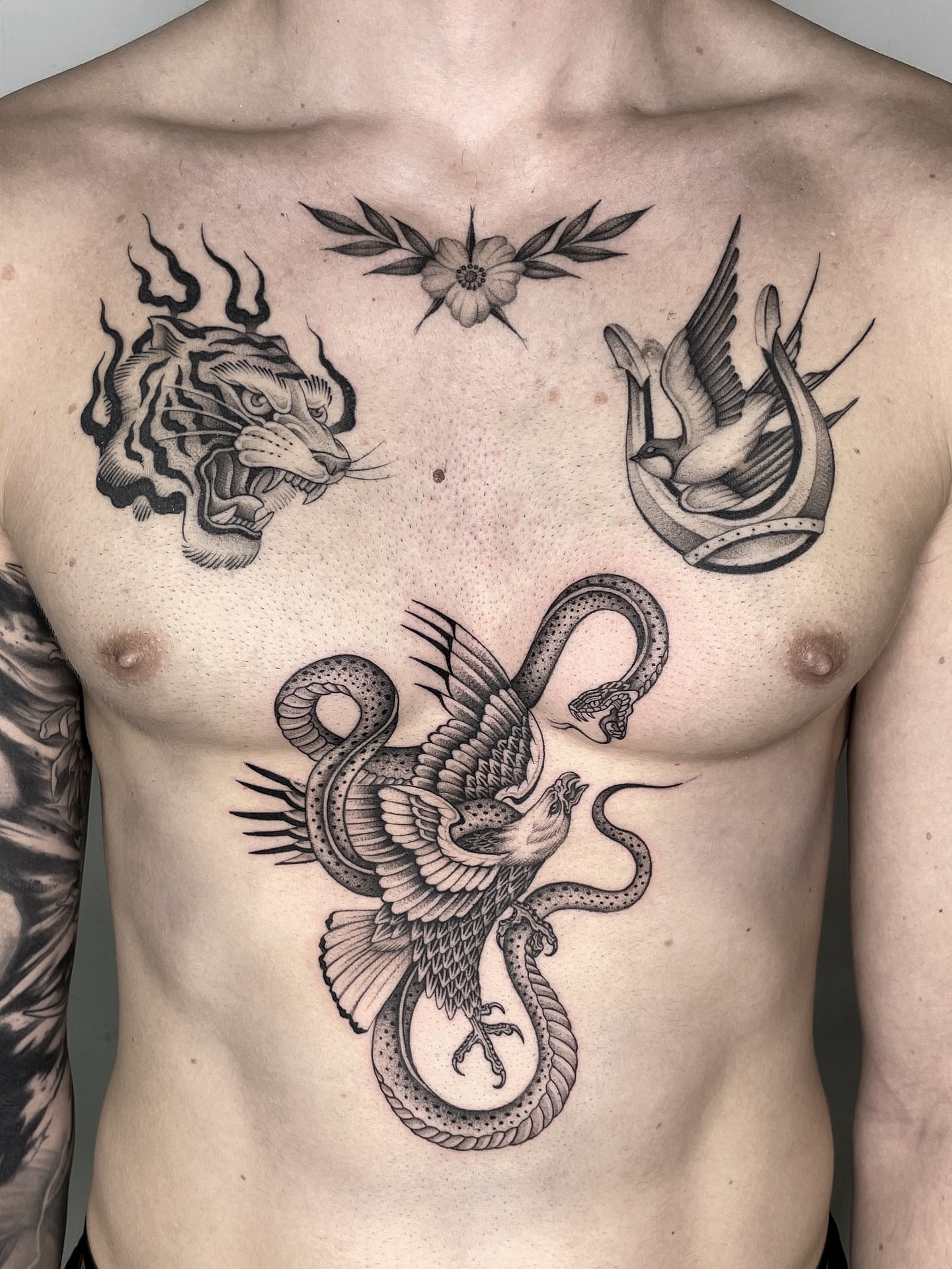 Dragon and phoenix black and grey tattoo on the chest by Gold Coast Tattoo Artist, Gold Coast, Queensland