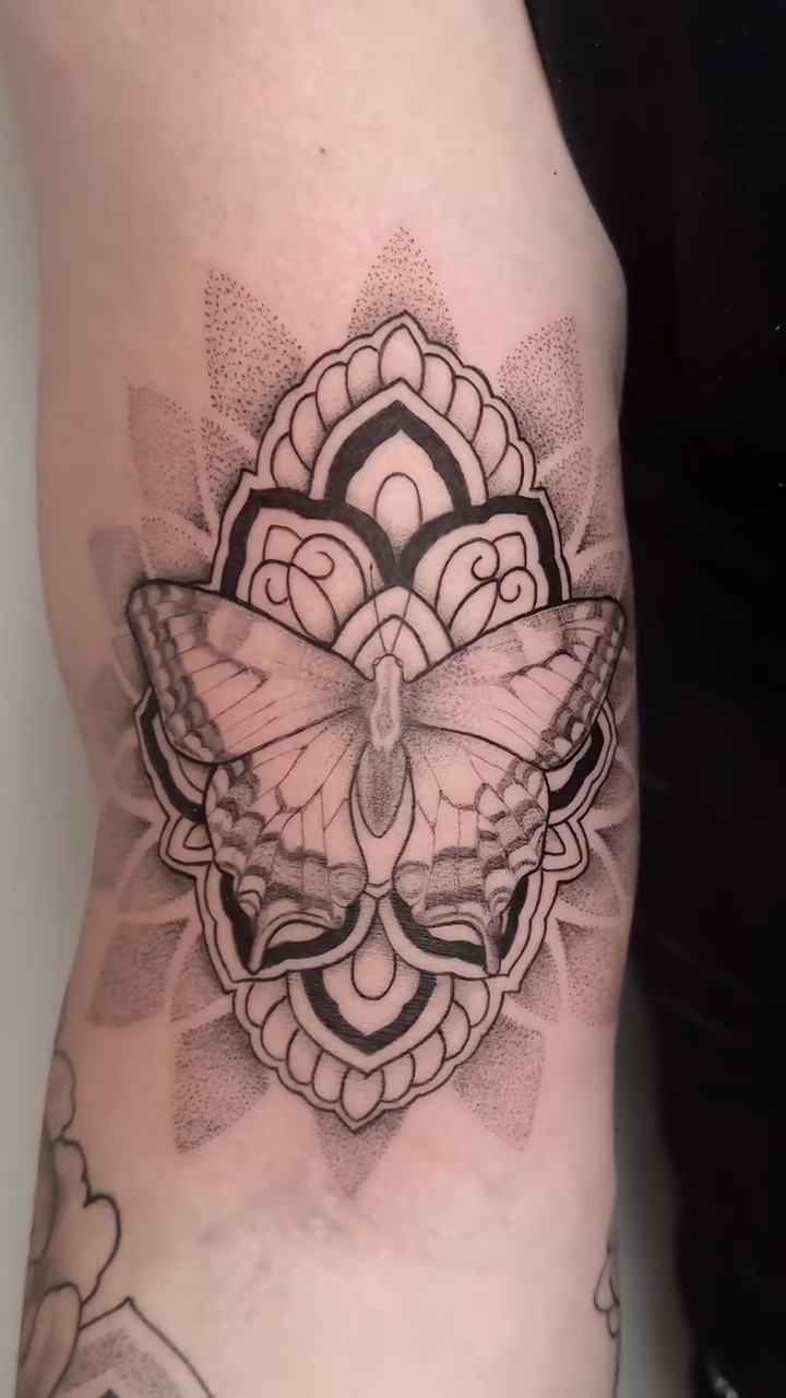 Butterfly and mandala dotwork tattoo by Rachel