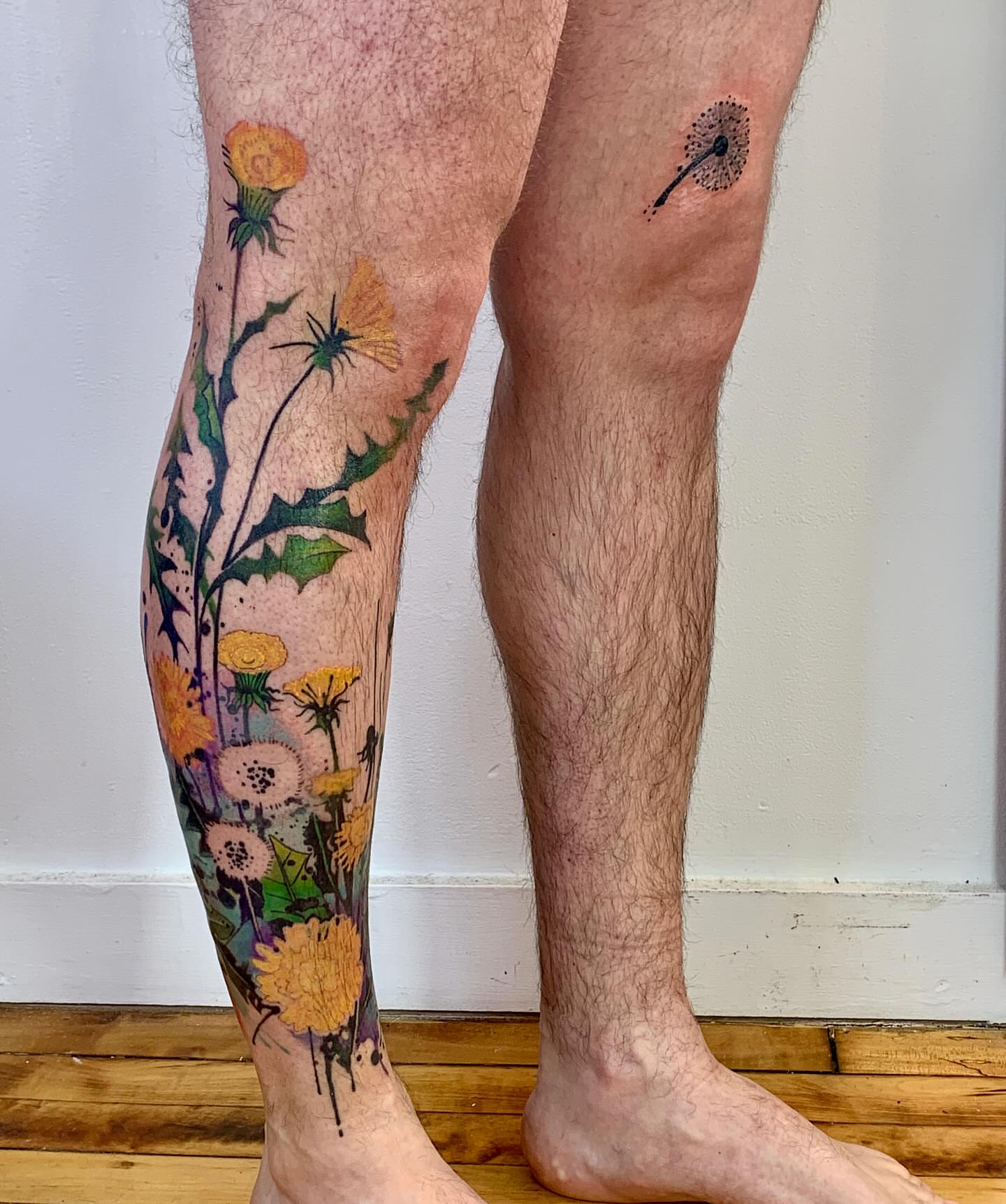 Wildflowers dotwork tattoo on the calf by Gene Coffey, New York, New York