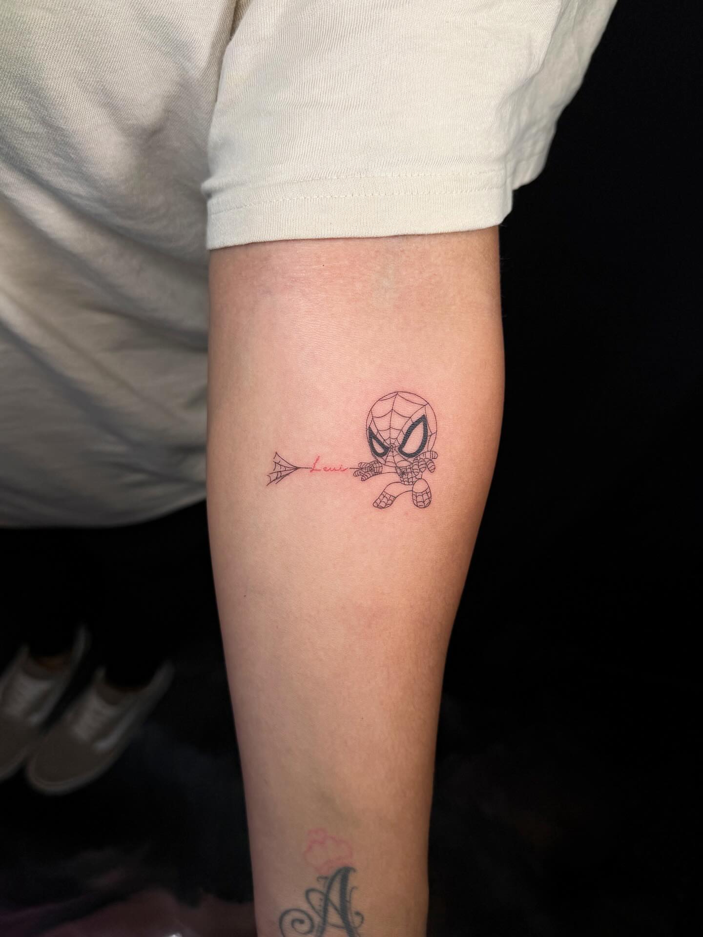 Chibi Spider-Man anime tattoo on the forearm by oc fine line & tiny tattoos