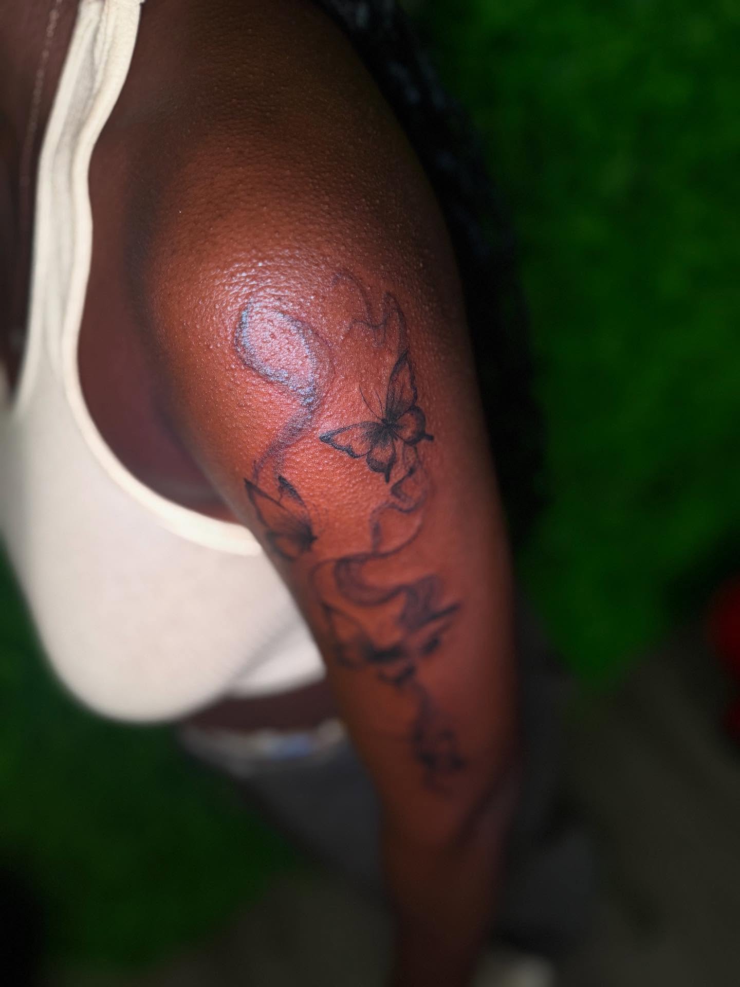 Floral design black and grey tattoo on the shoulder by Los Angeles Tattoo Artist