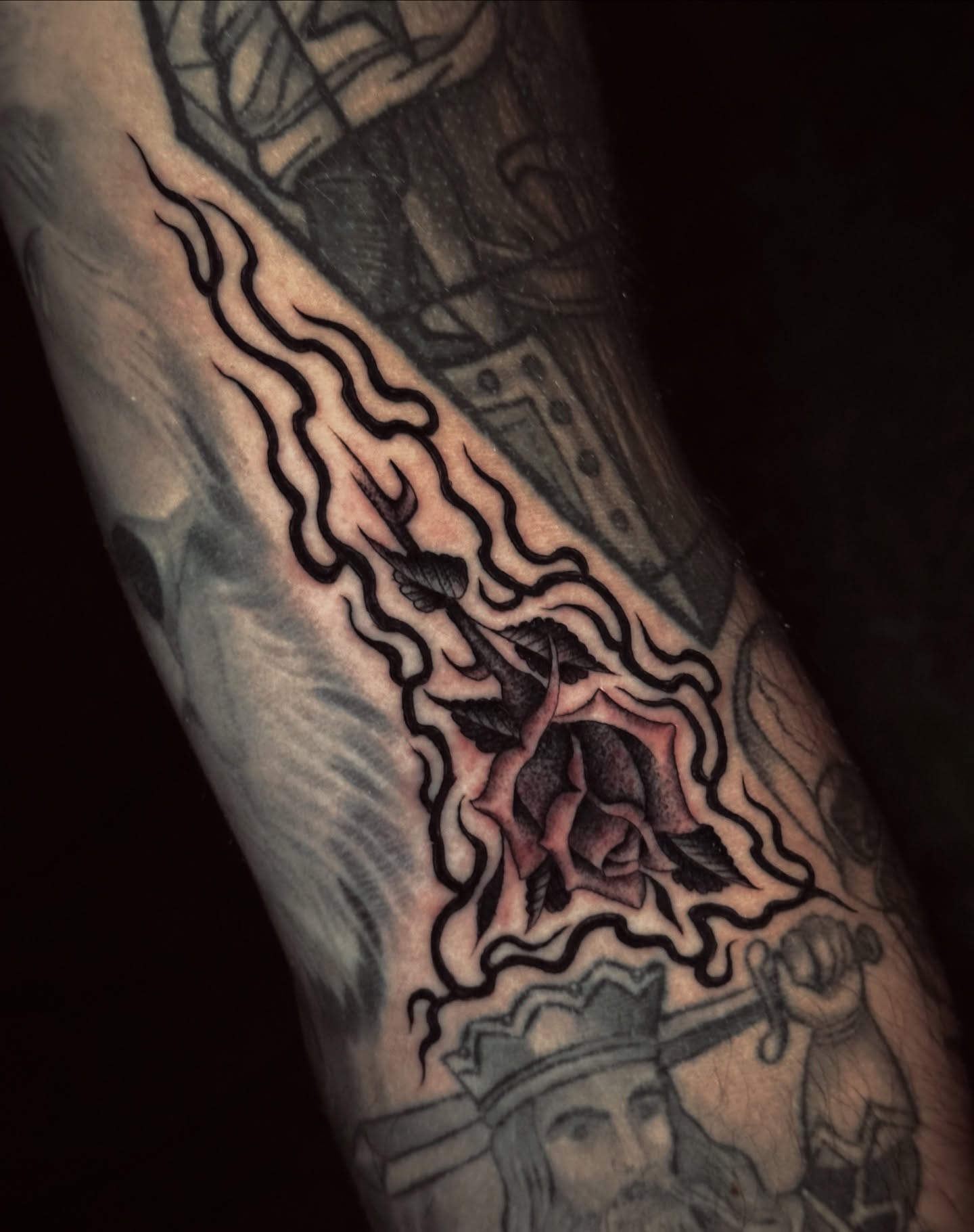 Rose and flame black and grey tattoo on the forearm by Matthew, Georgetown, Texas