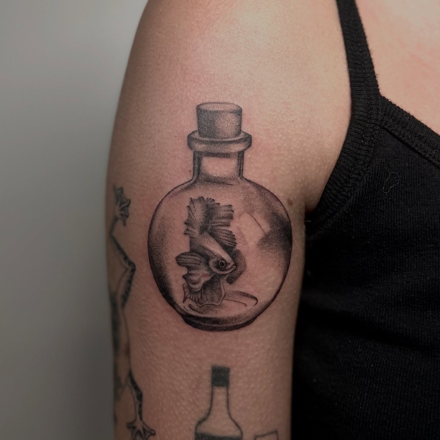 Fish in bottle black and grey tattoo on the forearm by ˖.𖥔 ݁˖anna hoffman˖ ⊹ ࣪ ˖, Salt Lake City, Utah