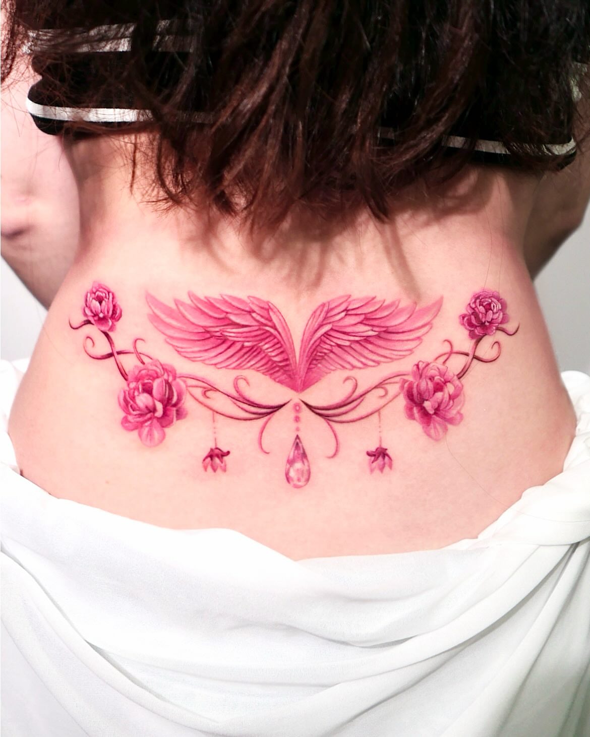 Wings and flowers new school tattoo on the neck by Cyber sigil & ornamental tattoo π₯