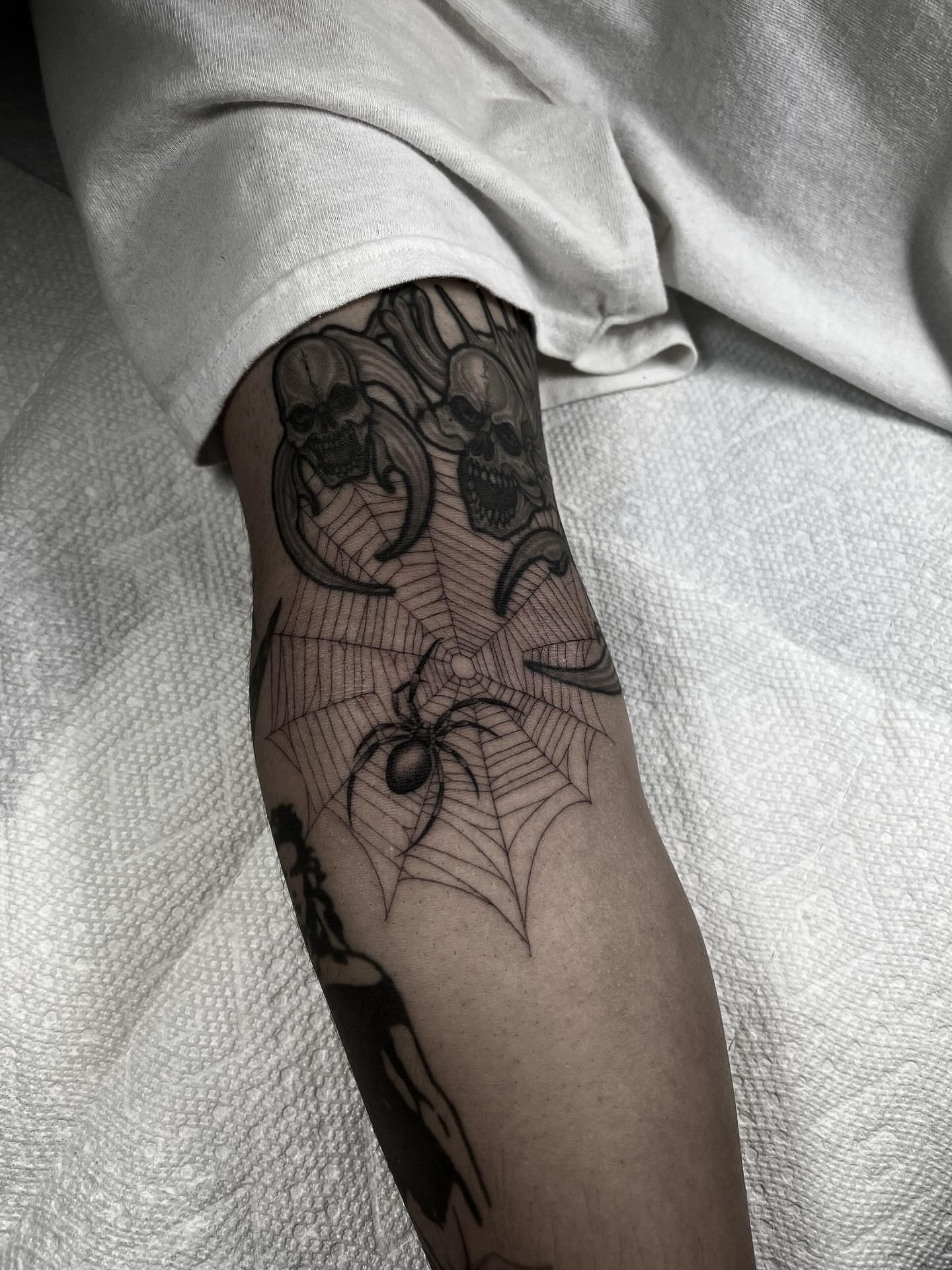 Spider web geometric tattoo on the forearm by linahsiaotattoo