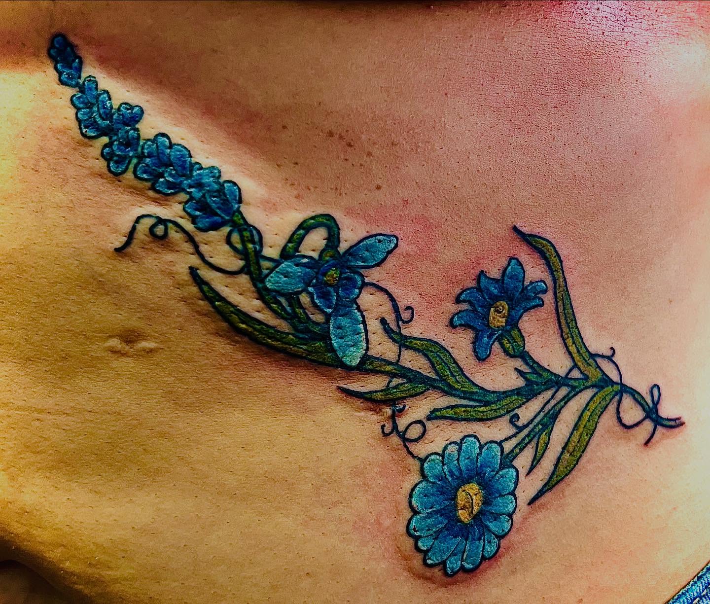Blue flowers new school tattoo on the chest by @lady_raven_tattoo