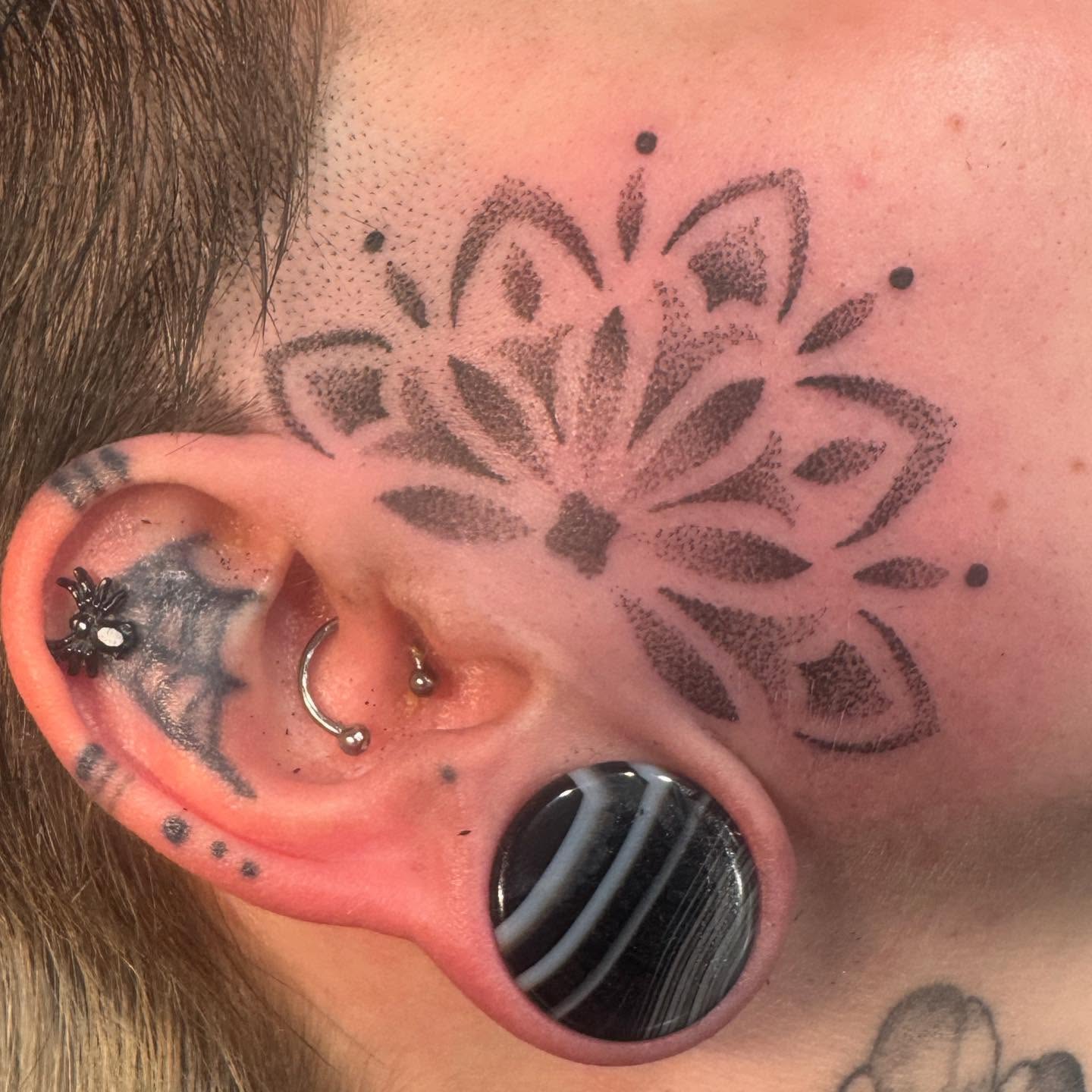Lotus flower dotwork tattoo on the neck by Ashley Rose - Minnesota Tattoo Artist