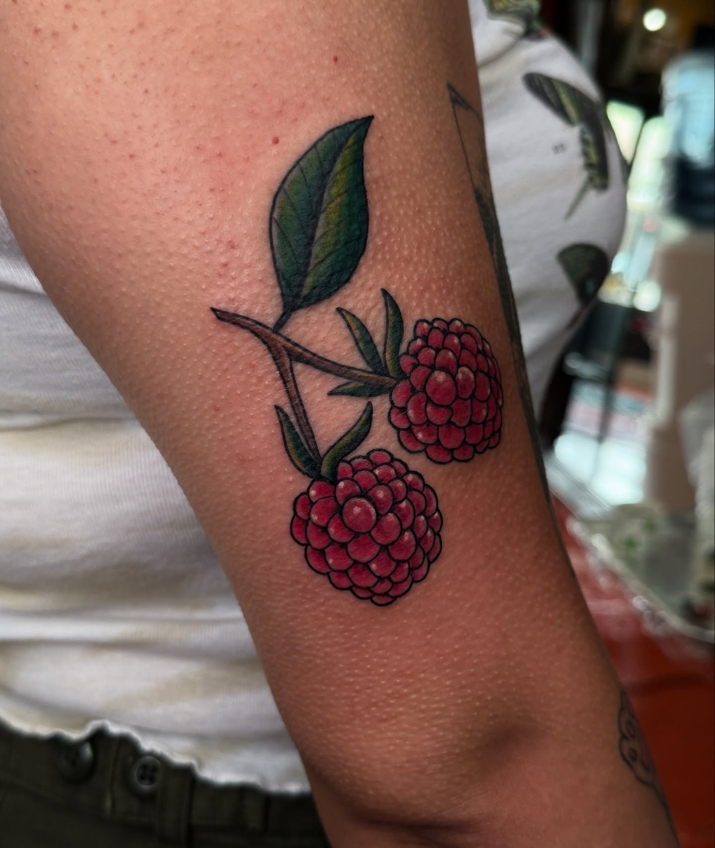 Raspberries American traditional tattoo on the forearm by Andre Guerra
