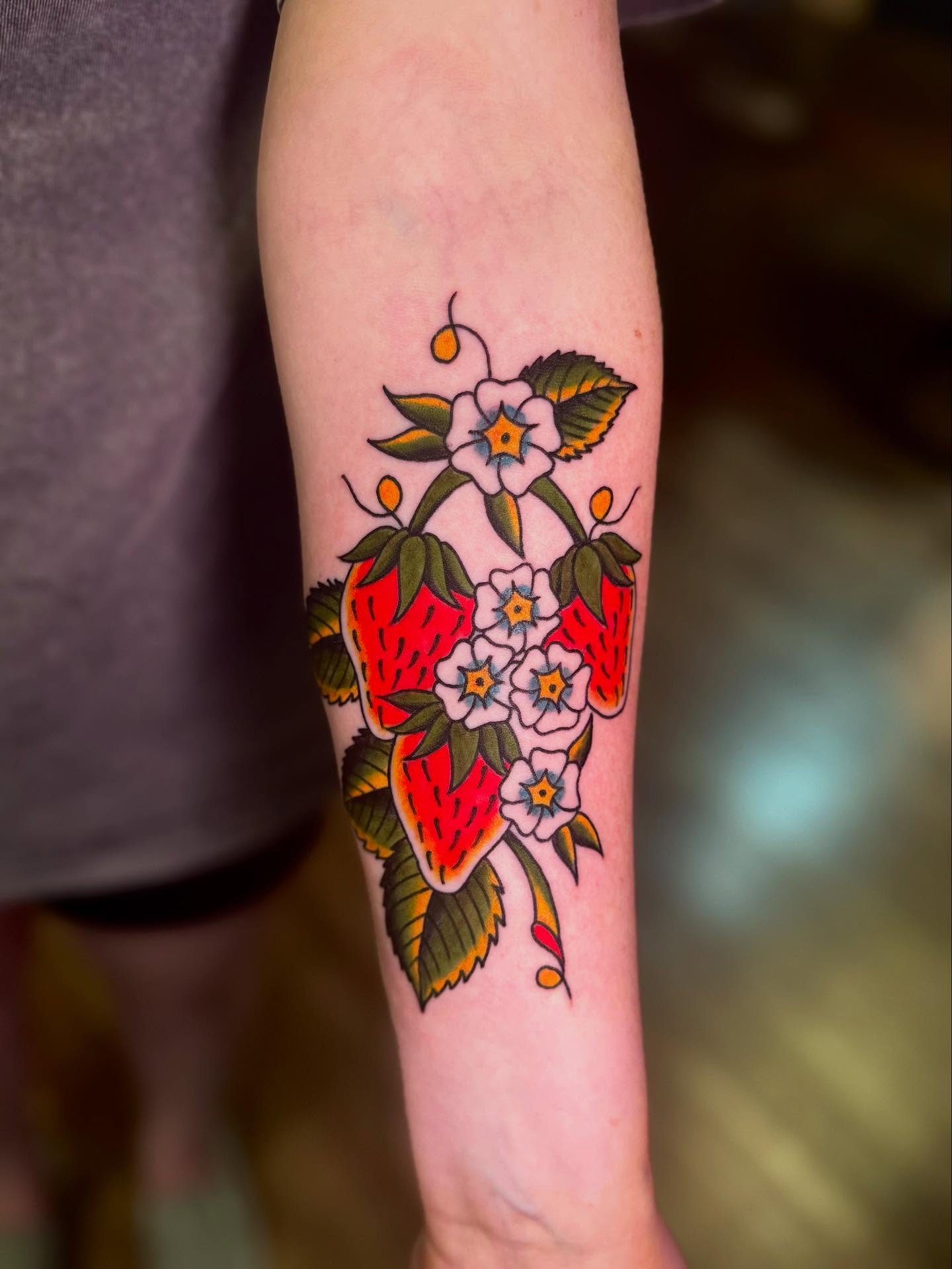 Strawberries and flowers American traditional tattoo on the forearm by 🌸Elena Scott🌵Ohio Tattoo Artist