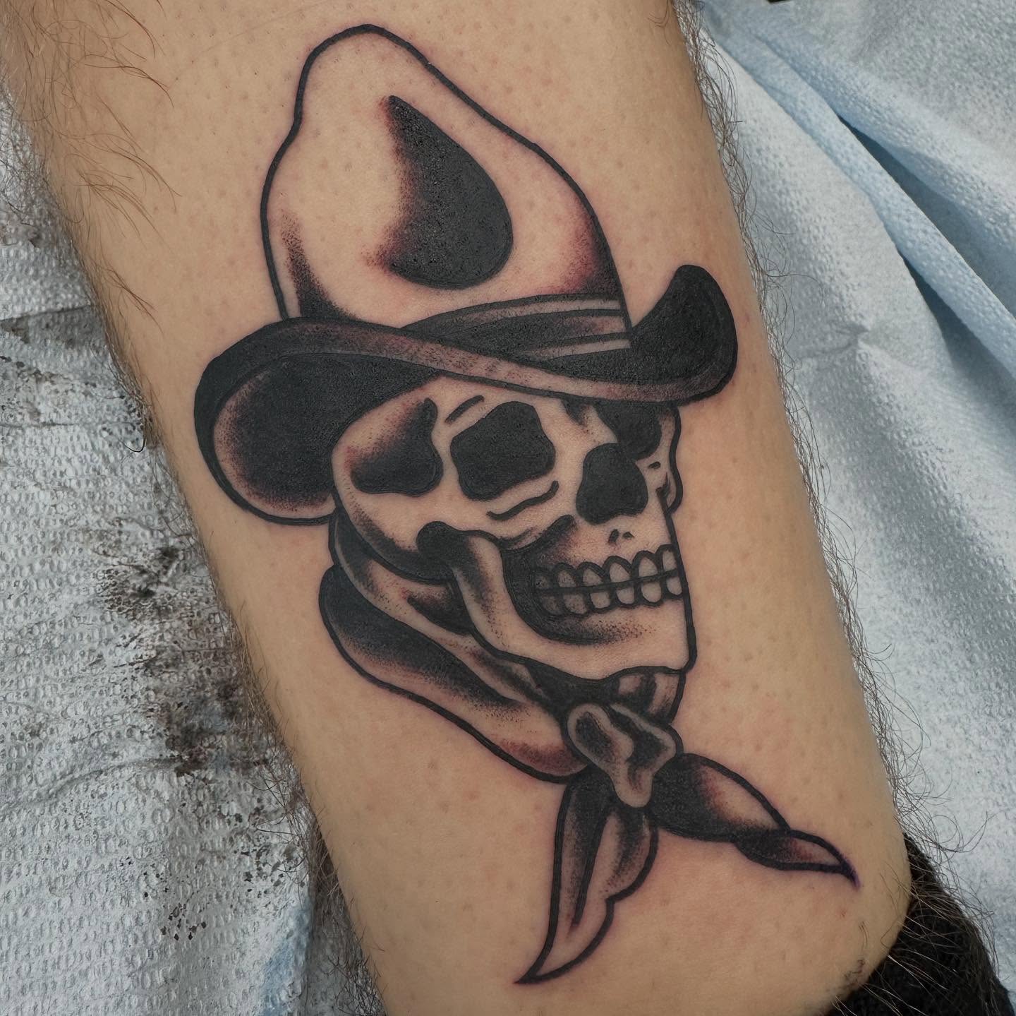 Cowboy skull black and grey tattoo on the forearm by Devin Spenny